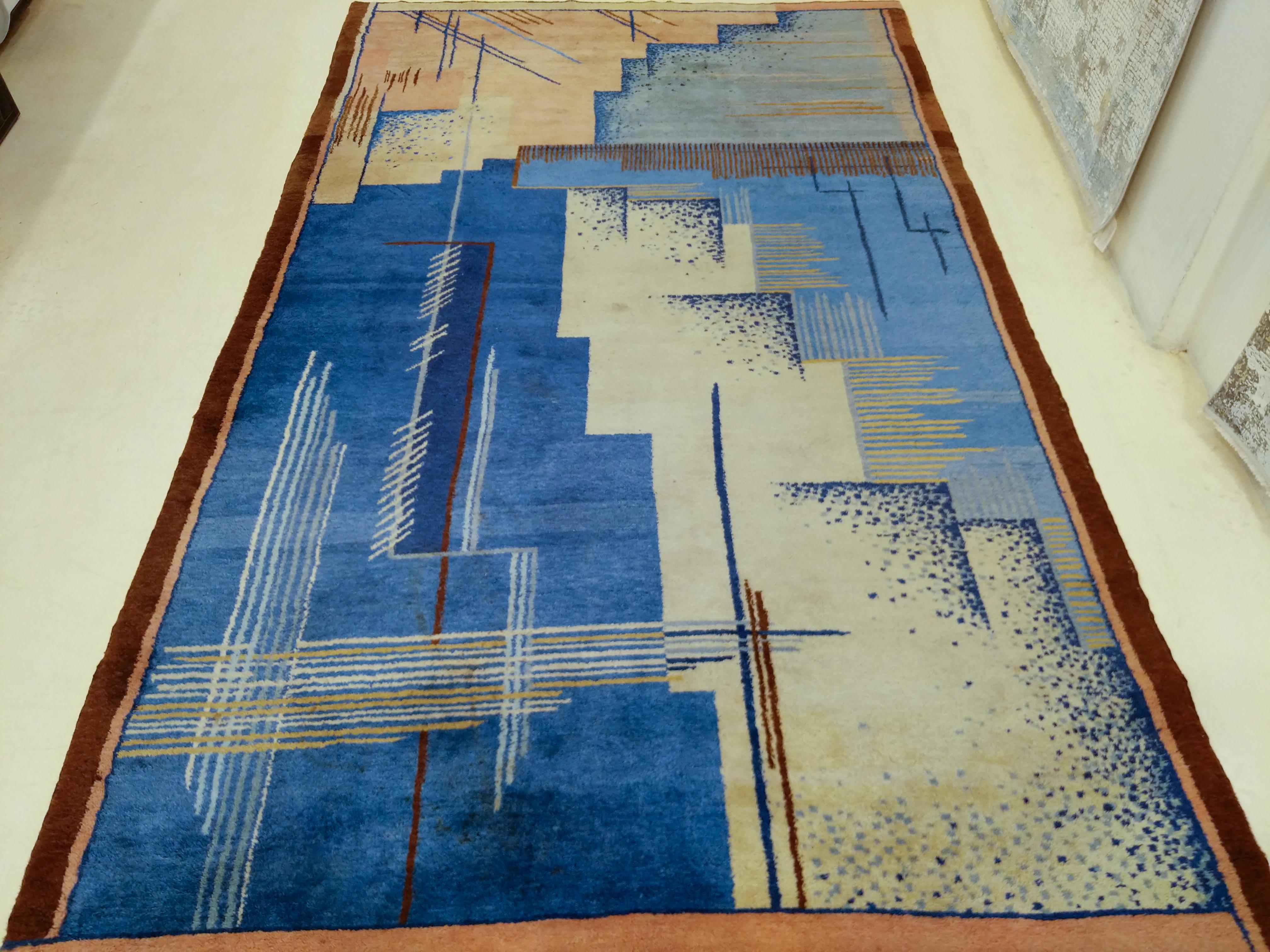 An extremely rare Art Deco rug designed in 1925 by Jean Burkhalter and commissioned by Pierre Chareau for a seaside mansion on the island of Corsica. This example, which is in mint condition, is part of a suite of five pieces, each crafted fit into