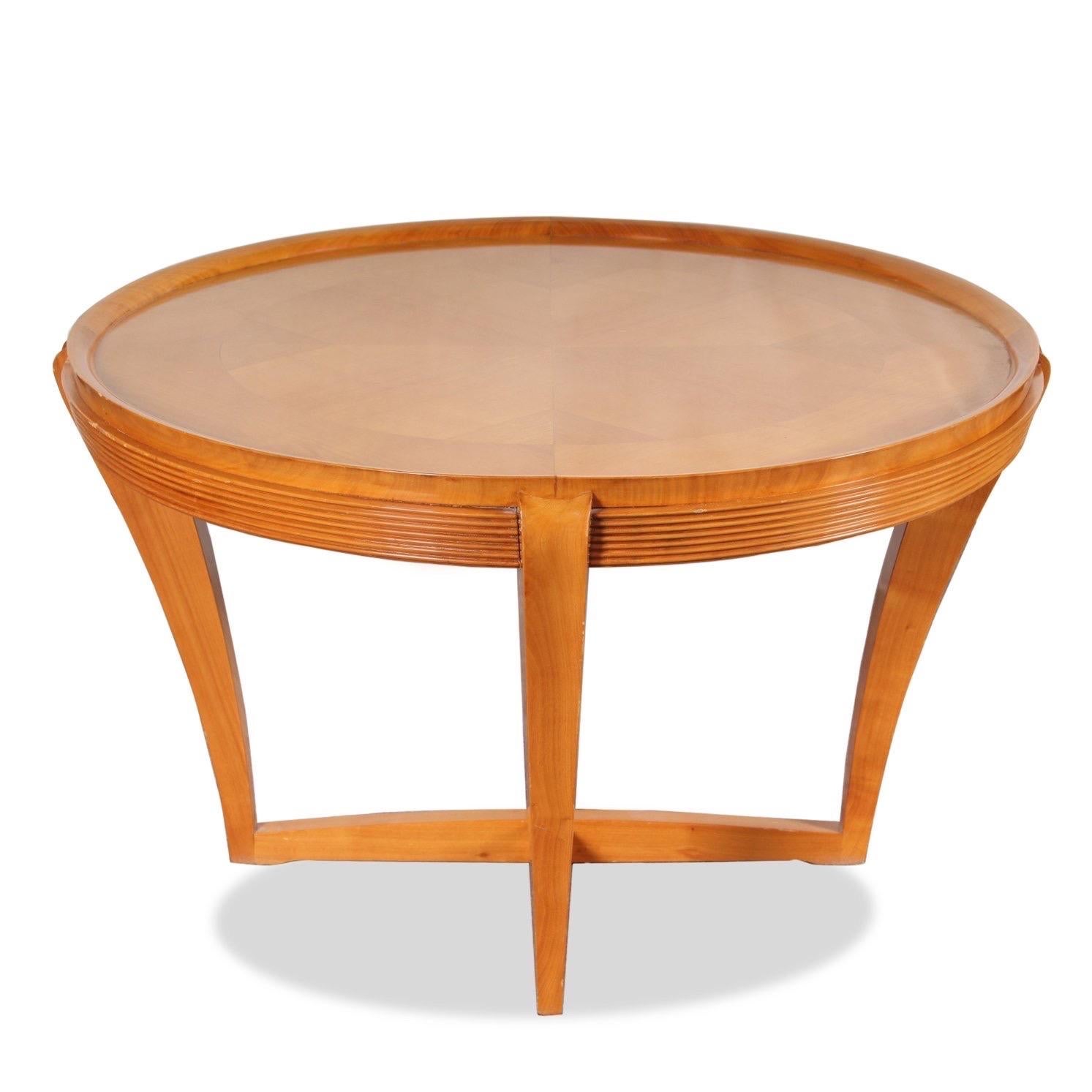 A satinwood occasional table with sunburst pattern on round recessed top, supported by an intersecting base.

Dimensions: 31” W x 19.5”H.