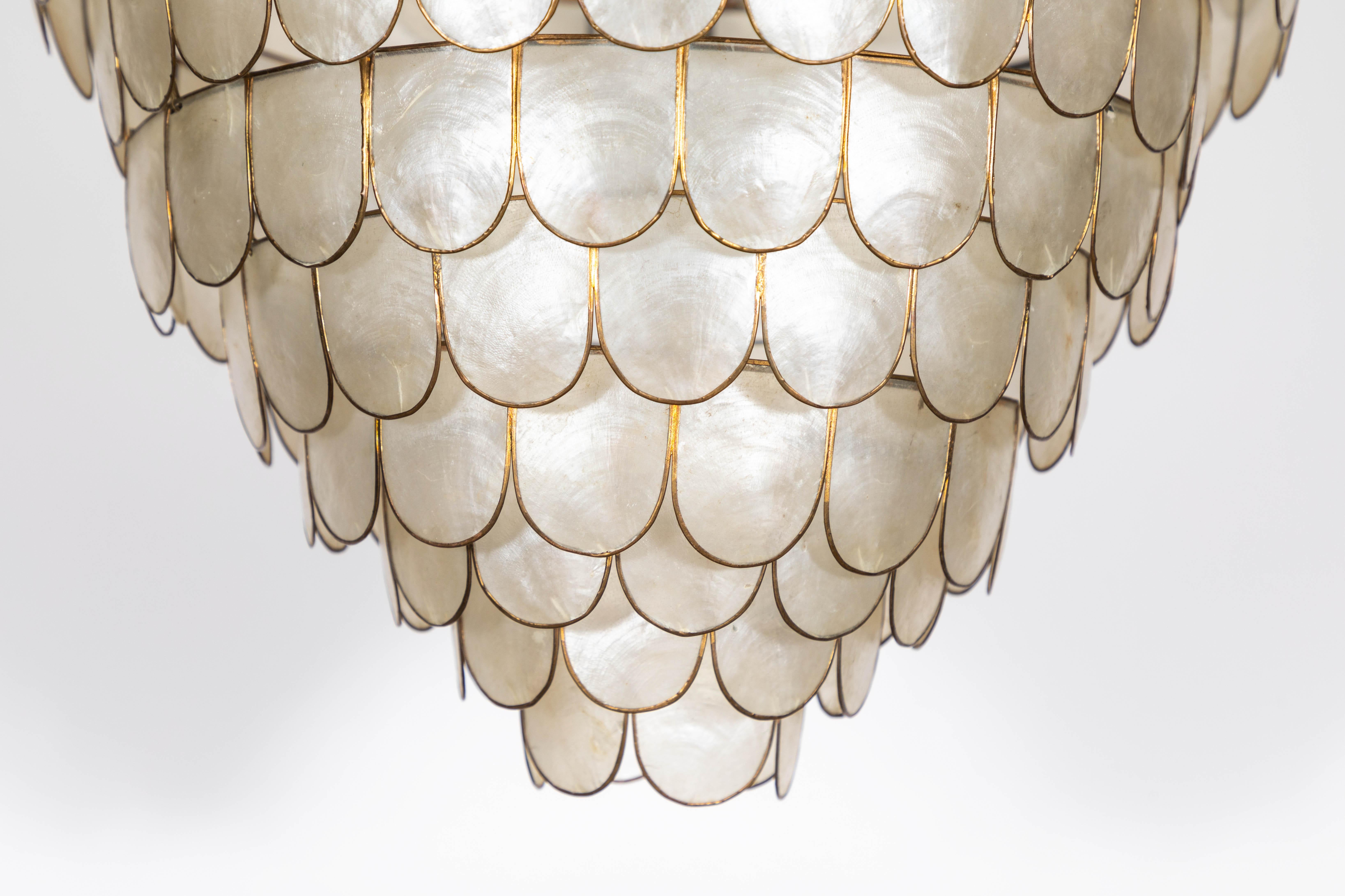French Art Deco scalloped capiz shell pendant with brass details.