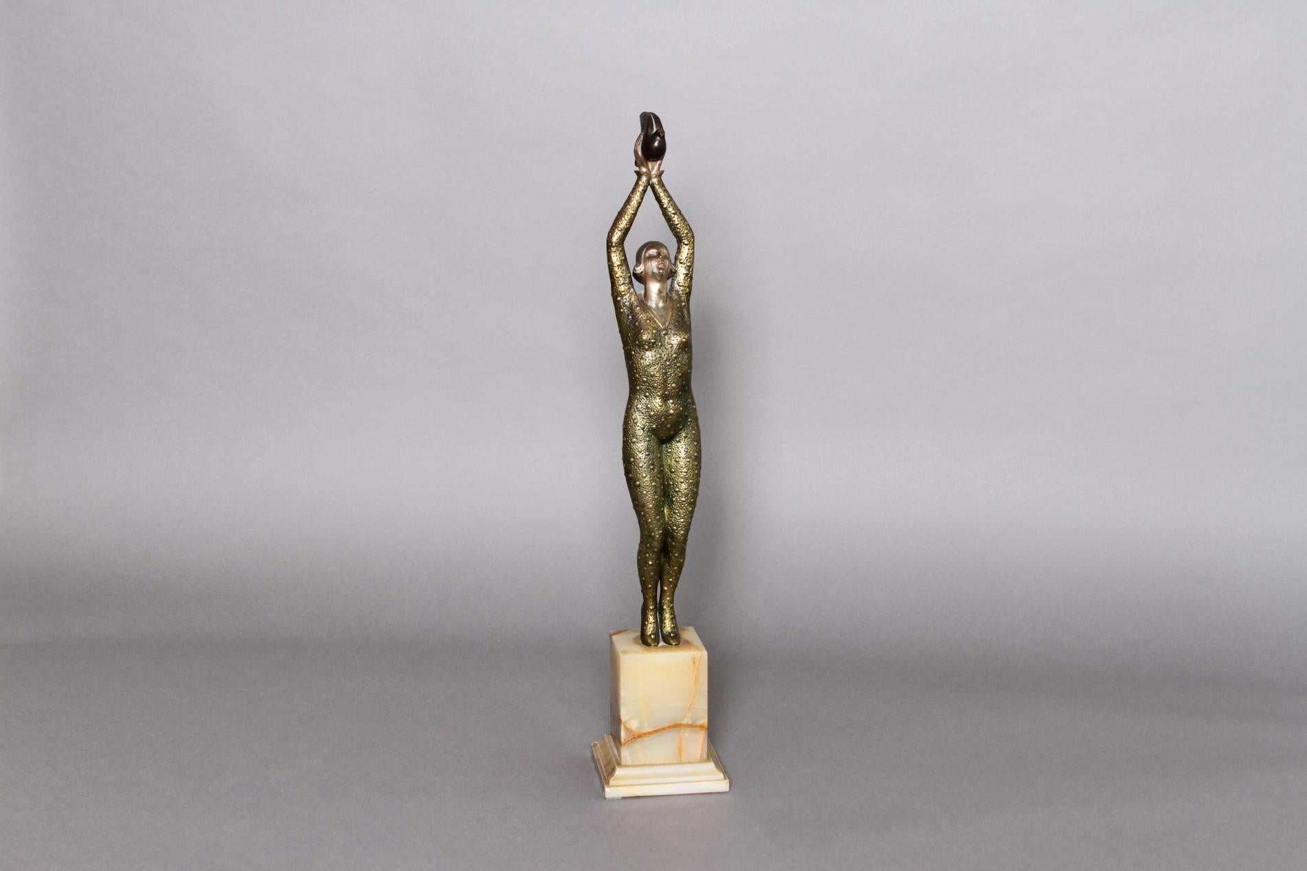 French Art Sculpture by Raoul Lamourdedieu, french sculptor from the Art deco period. The sculpture is in all patinated bronze and has an onyx base. It represents a woman with a dove. 