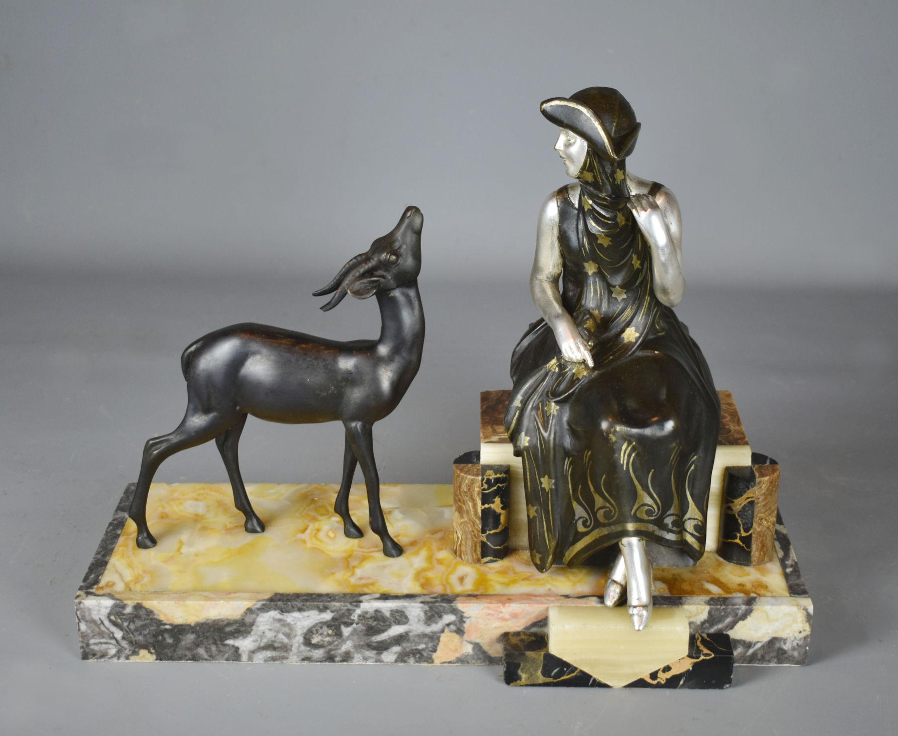 French Art Deco sculpture of lady and gazelle, 1930

A delightful original figural group depicting a young lady and a gazelle. They are both cast in spelter and cold painted. The lady is in gilt silver with a hand painted dress and the gazelle in