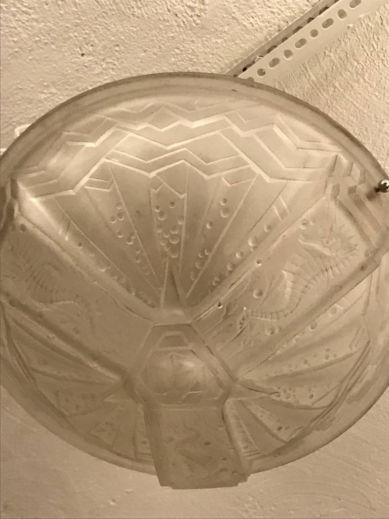 French Art Deco seahorse flush mount chandelier signed by Muller Frères Luneville. Having clear frosted glass with over flowing geometric and seahorse motif details. Supported by three nickeled balls. Has been rewired for American use. Taking three