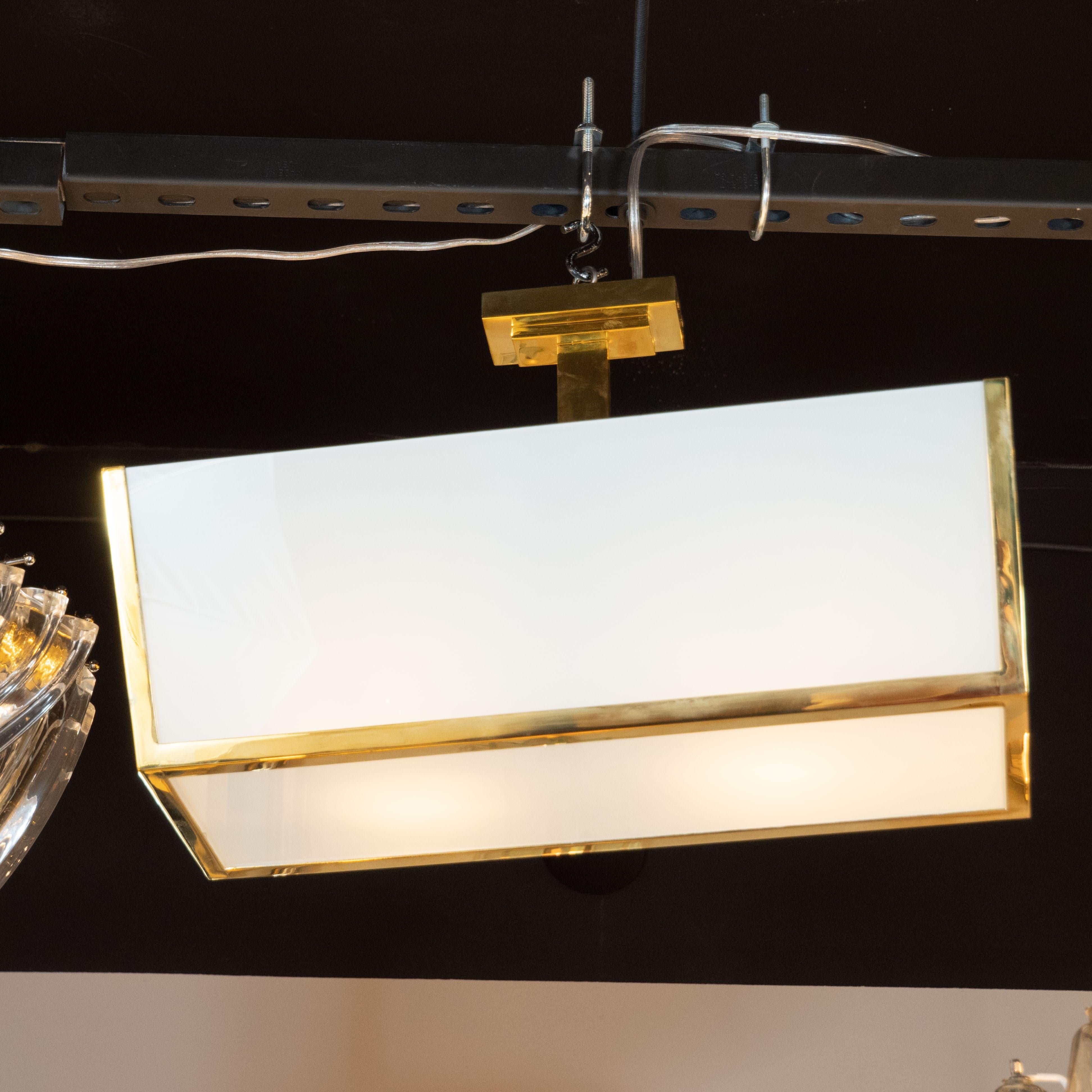Jean Perzel has been one of the most renowned lighting ateliers in Paris for more than 80 years. This though, is the real deal-original and stunning fixture from circa 1935. With white glass shades housed in a polished brass frame with solid brass