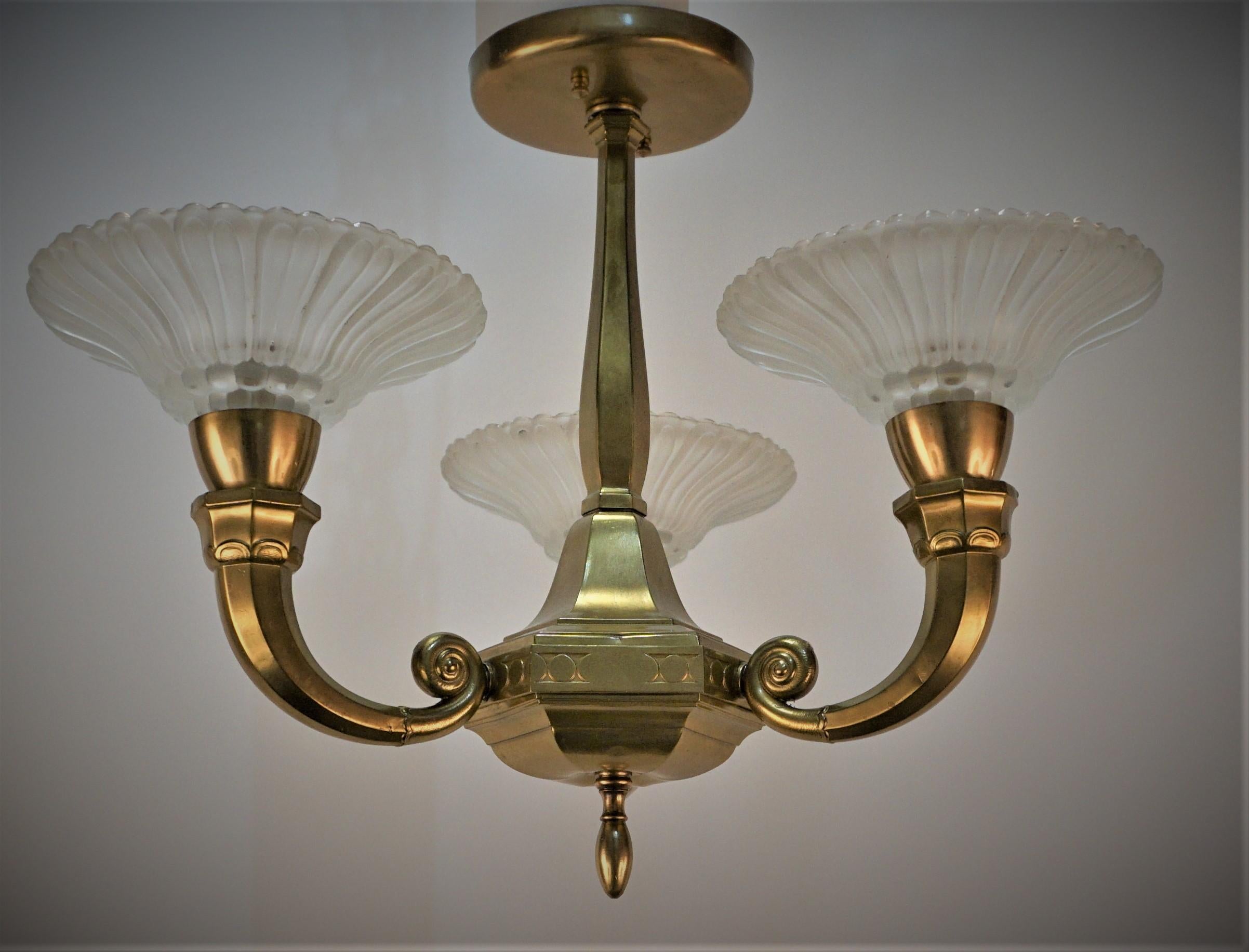 Semi flush mount three light, clear frost glass with bronze frame art deco chandelier.
Professionally rewired and ready for installation.
100 watts max each light.