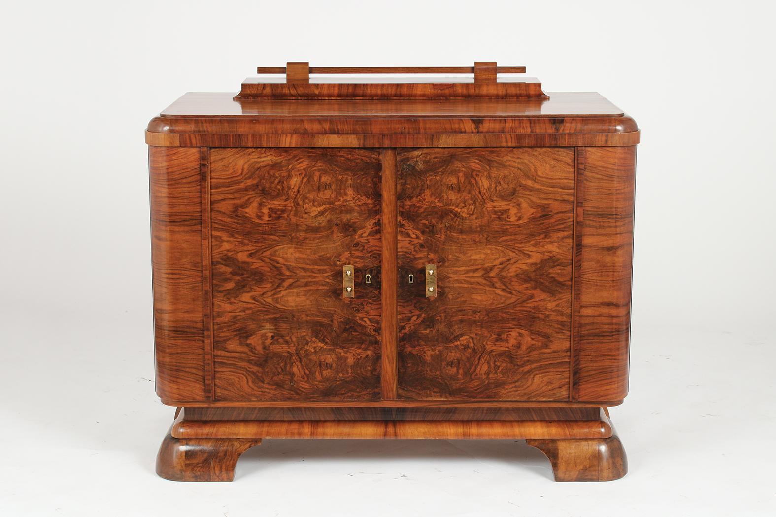 This French Art Deco Server has been professionally restored and is made out of walnut wood with its original finish that has just been newly waxed & polished. This Server has a unique design and features a wooden top and curved side design.- The