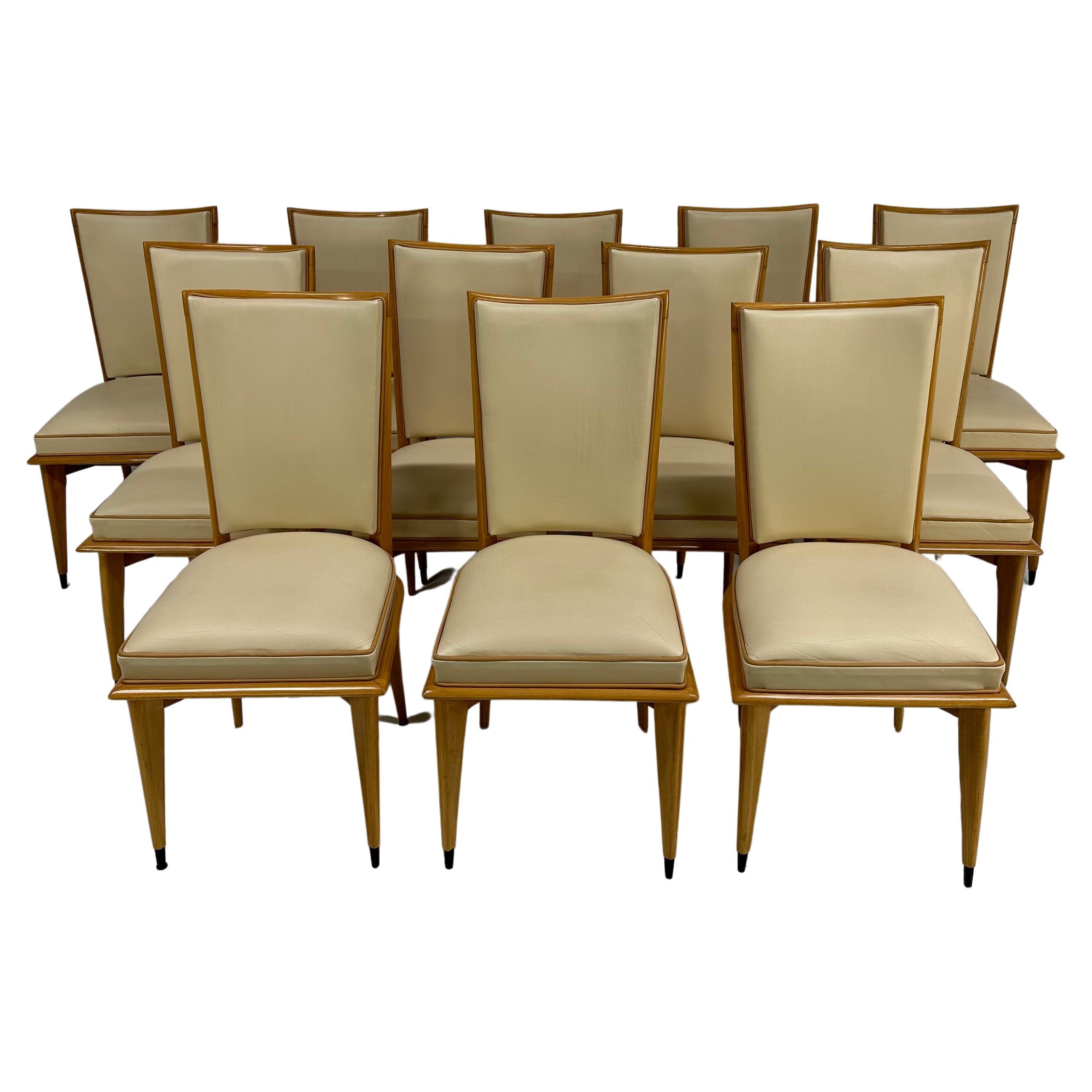 Ensemble Art Déco français de 12 chaises en érable et cuir crème, années 1930 en vente