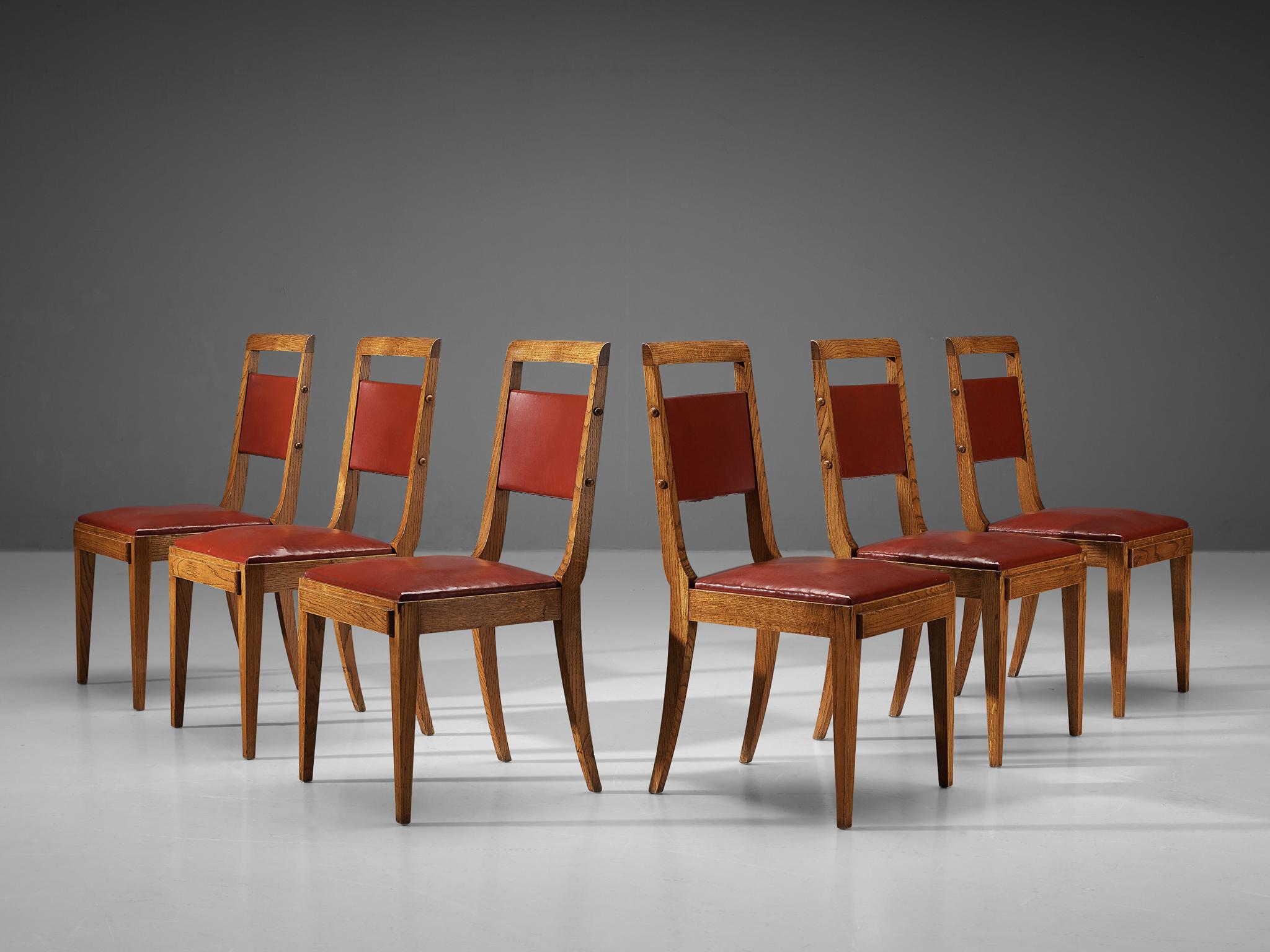 Set of six dining chairs, oak, leatherette, France, 1930s/1940s

These French dining chairs employ the stylistic traits of the French Art Deco in the period of the 1930s and 1940s. In addition, the design reminds of the works by French master