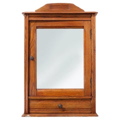 Antique French Art Deco shaving cabinet in oak with beveled mirror