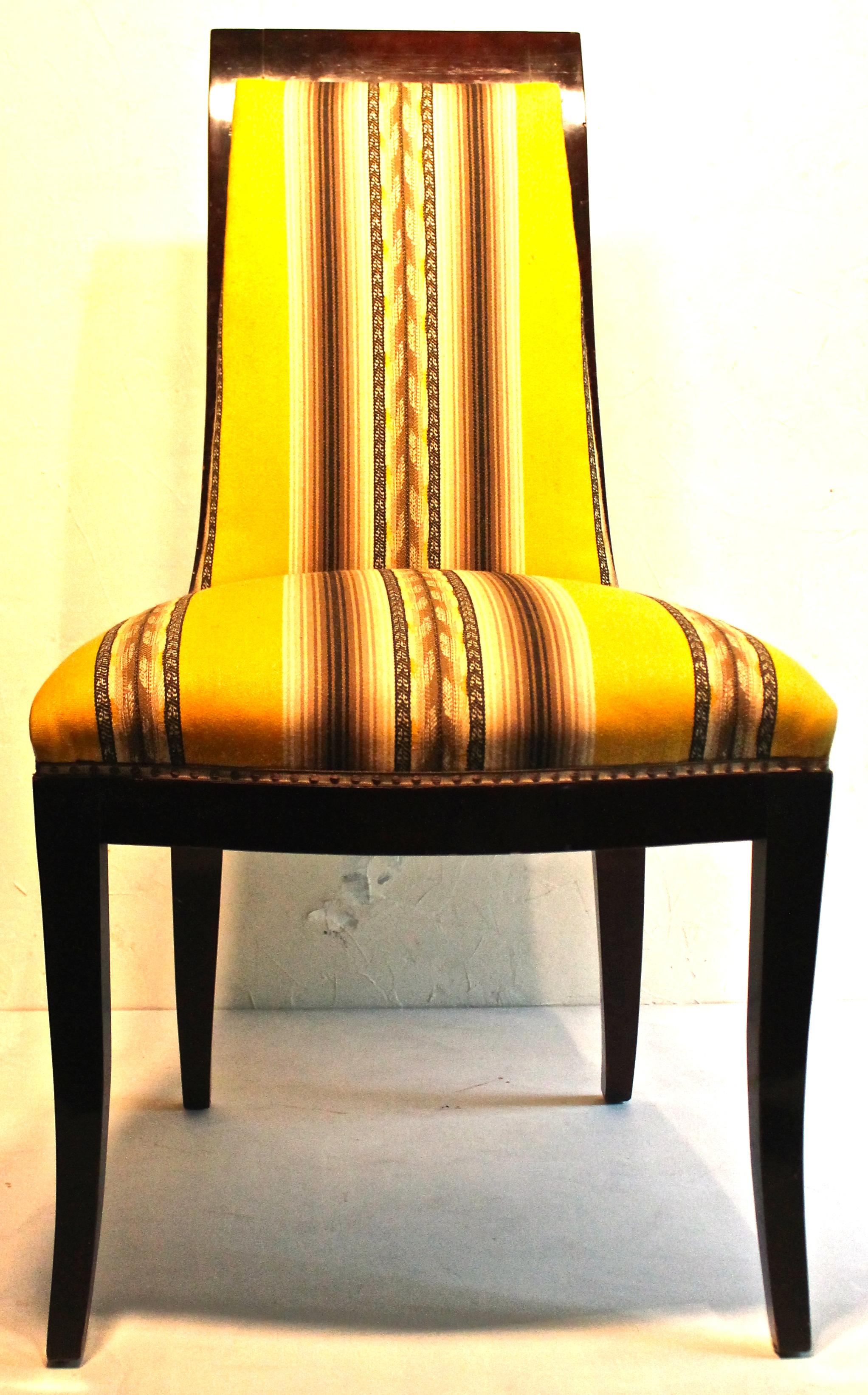 Extraordinary deco side chair with a high finish dark lacquer, appropriately upholstered in a striking yellow and black fabric.