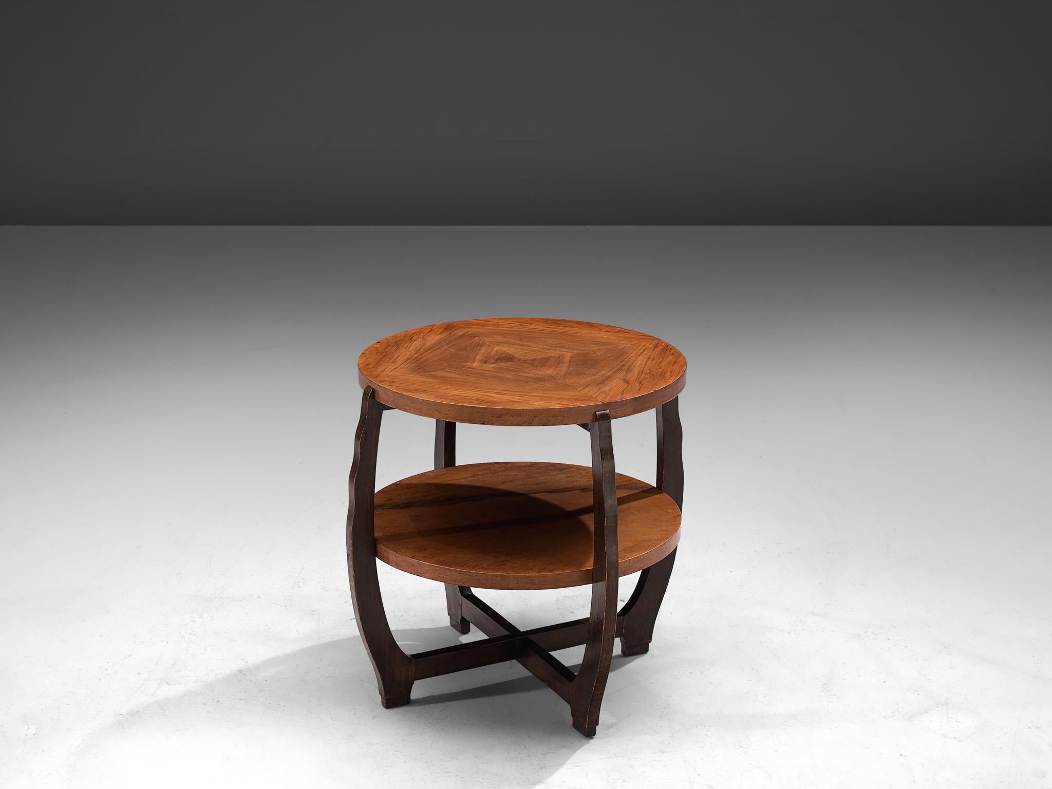 Side table, walnut, France, 1940s

This side table of French origin is created in one of the most influential periods for the arts namely the Art Deco Movement. Its cross-shaped frame with bent sides holds the table tops firmly in place. Note the
