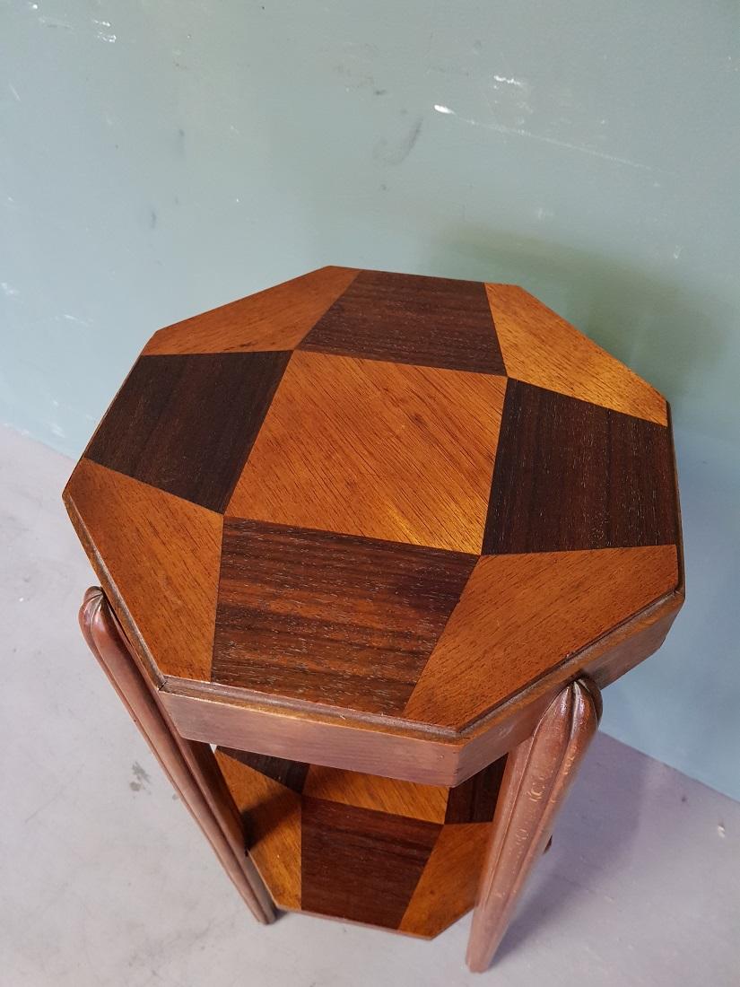French Art Deco side table whose blades are inlaid with various woods and the stylized legs are made of beech, are further in good condition. Originating from the 1930s.

The measurements are,
Depth 30 cm/ 11.8 inch.
Width 30 cm/ 11.8 inch.
Height