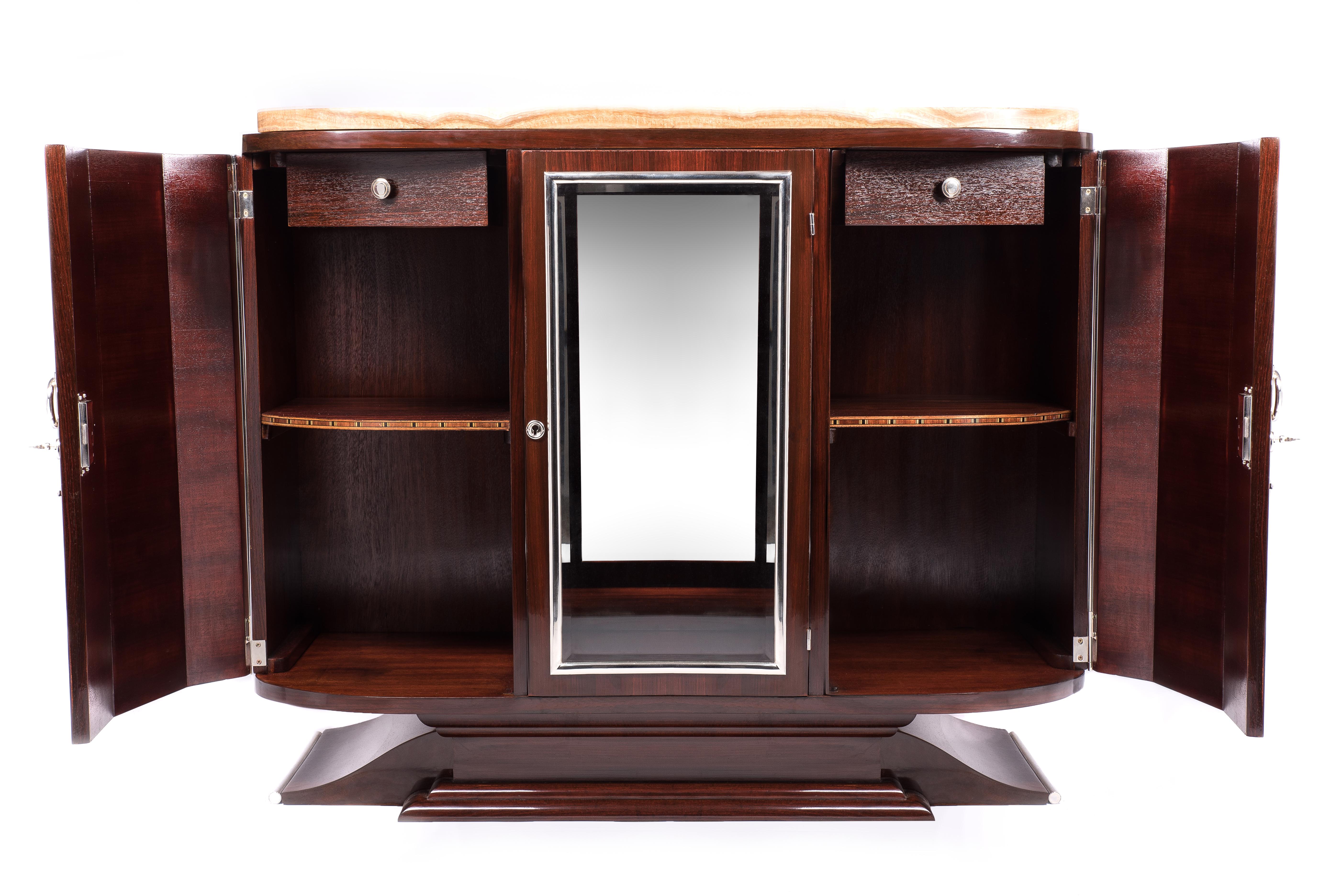 Fantastic original French Art Deco sideboard made for quality living rooms and interiors. Fully refurbished, with high gloss varnished mahogany veneer, metal parts reconditioned, marble slab polished. The 3-door sideboard has a middle glass door