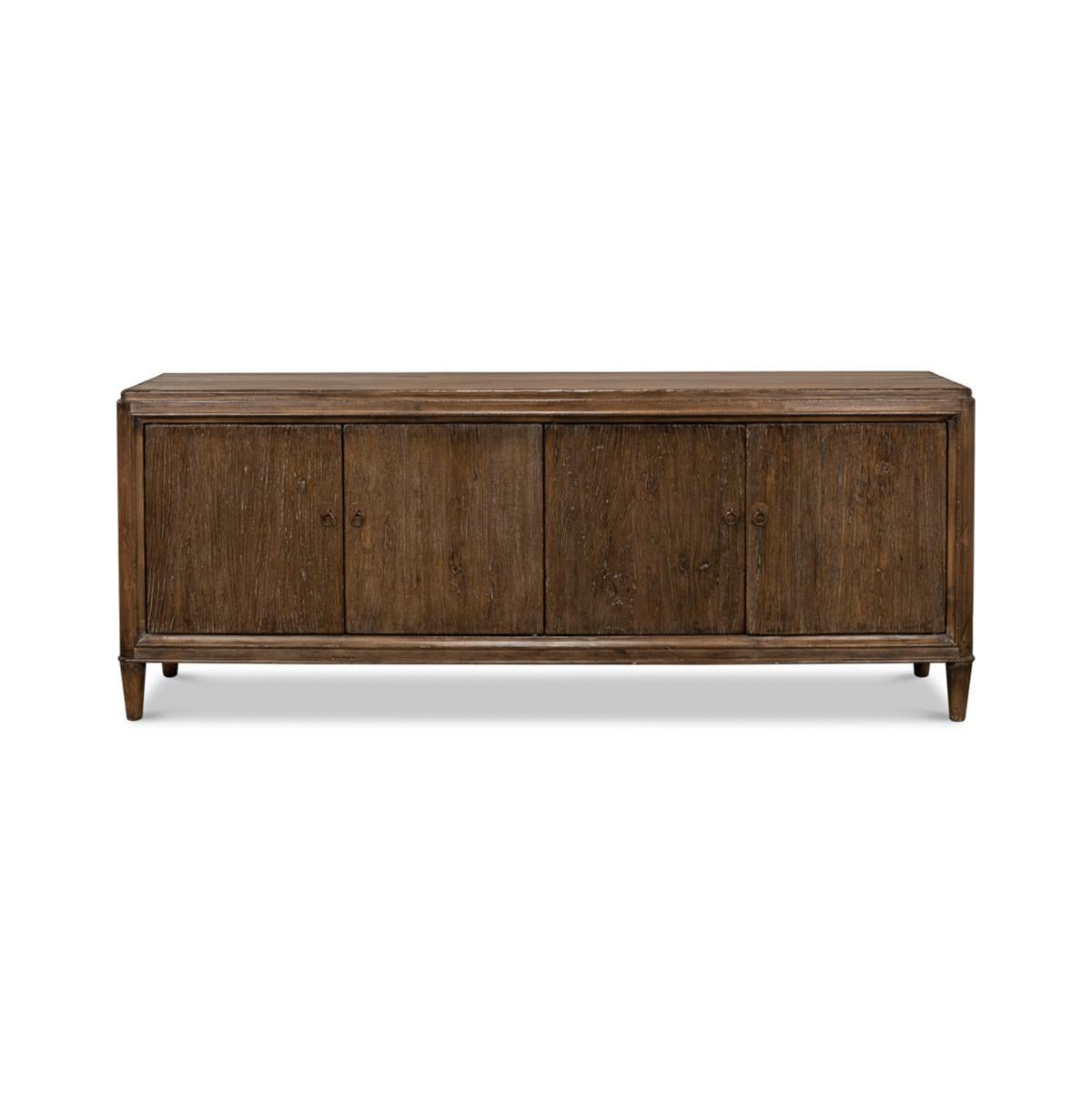 French Art Deco sideboard, made of Elm, the sideboard has four doors opening to two separate compartments. With an antiqued rustic finish and raised on round tapered legs. The interior with two removable shelves.

Dimensions: 87