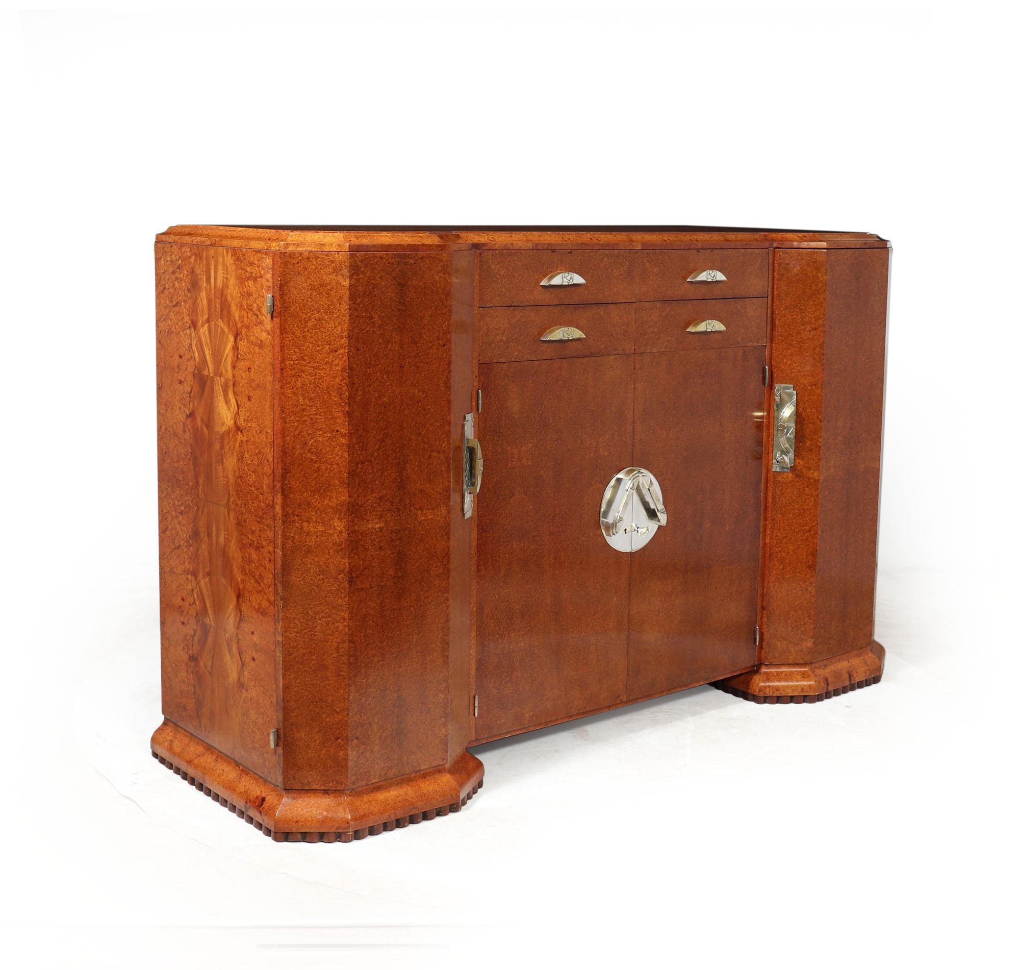 FRENCH ART DECO SIDEBOARD IN AMBOYNA
This exquisite French Art Deco Sideboard, crafted in 1925, is a true rarity of unparalleled quality. Constructed from the finest amboyna veneers and elegantly lined with satinwood, it exudes sophistication and