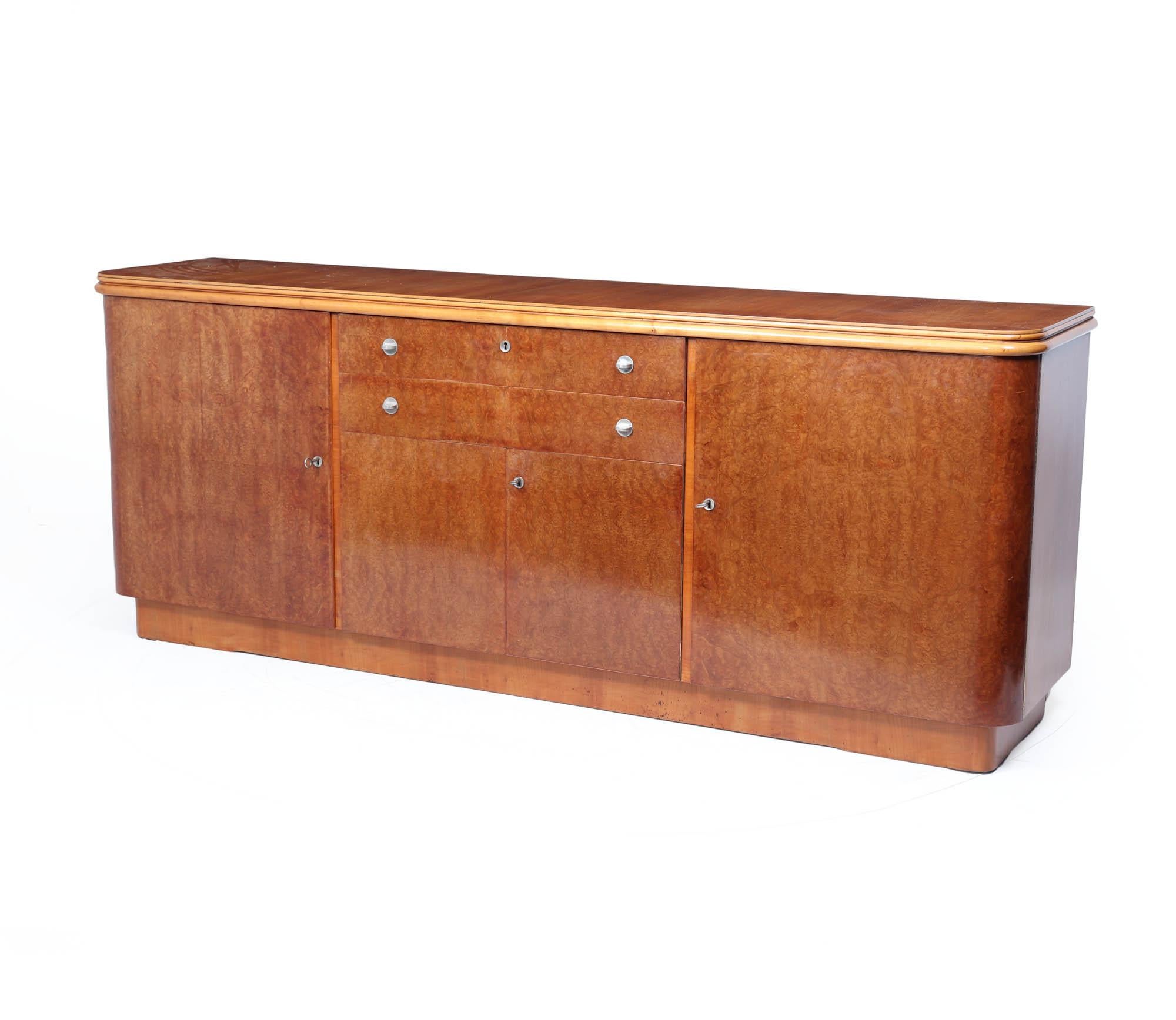 Art Deco Sideboard
A sleek and generously proportioned French Art Deco sideboard, dating to the 1930s, with a warm, honey-toned burr maple veneer across the doors and drawer fronts, and a contrasting cherry top.

French Art Deco, circa 1930
Burr