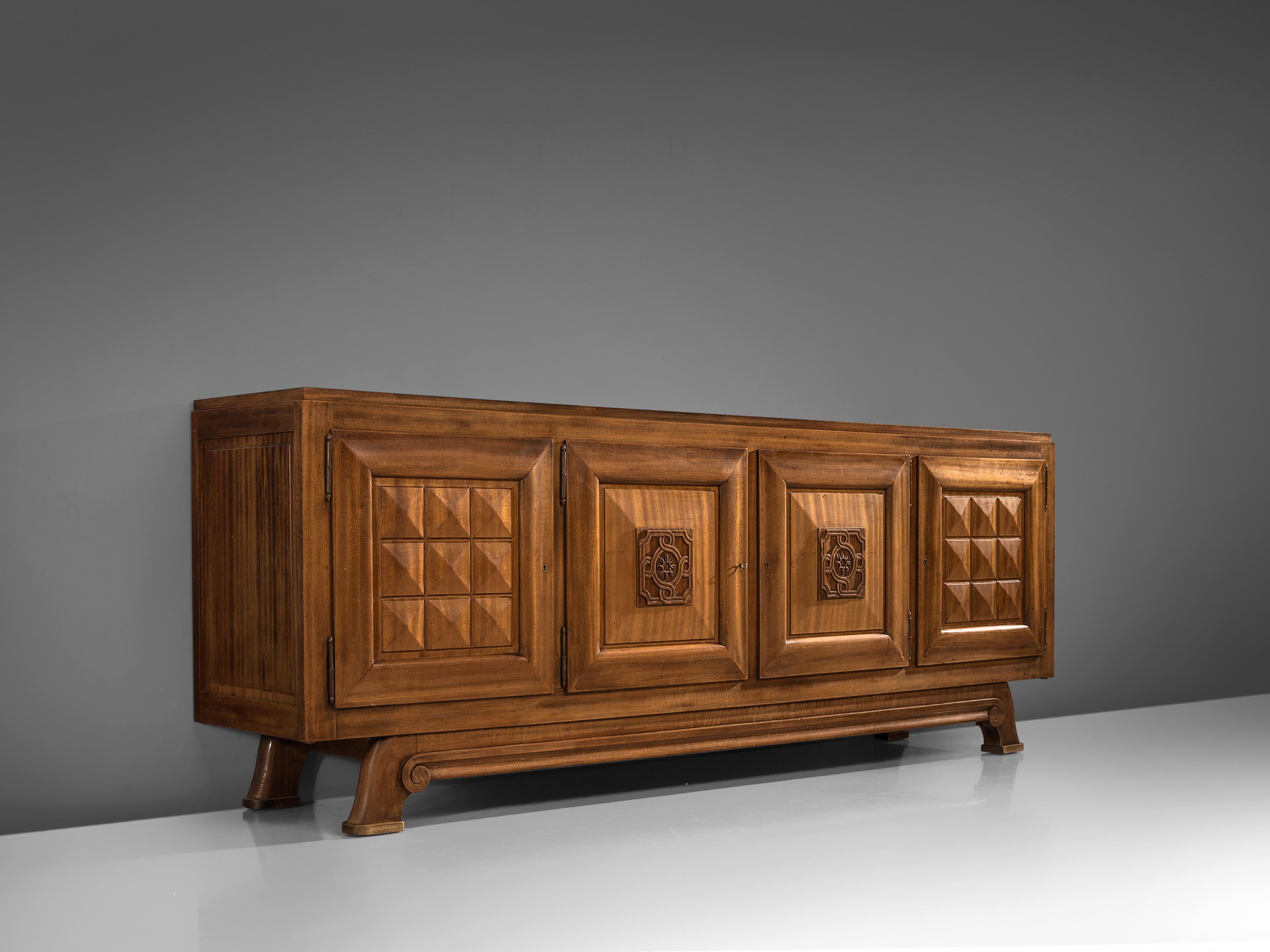 Art Deco credenza, mahogany, France, 1930s

Sturdy credenza in with graphical door panels and parquet top. This four-door sideboard is equipped with several shelves and drawers which provide plenty of storage space. Combined with the door panels