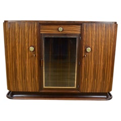 Buffet Art déco français, ébène de Macassar et laiton, vitrine en verre, années 1930