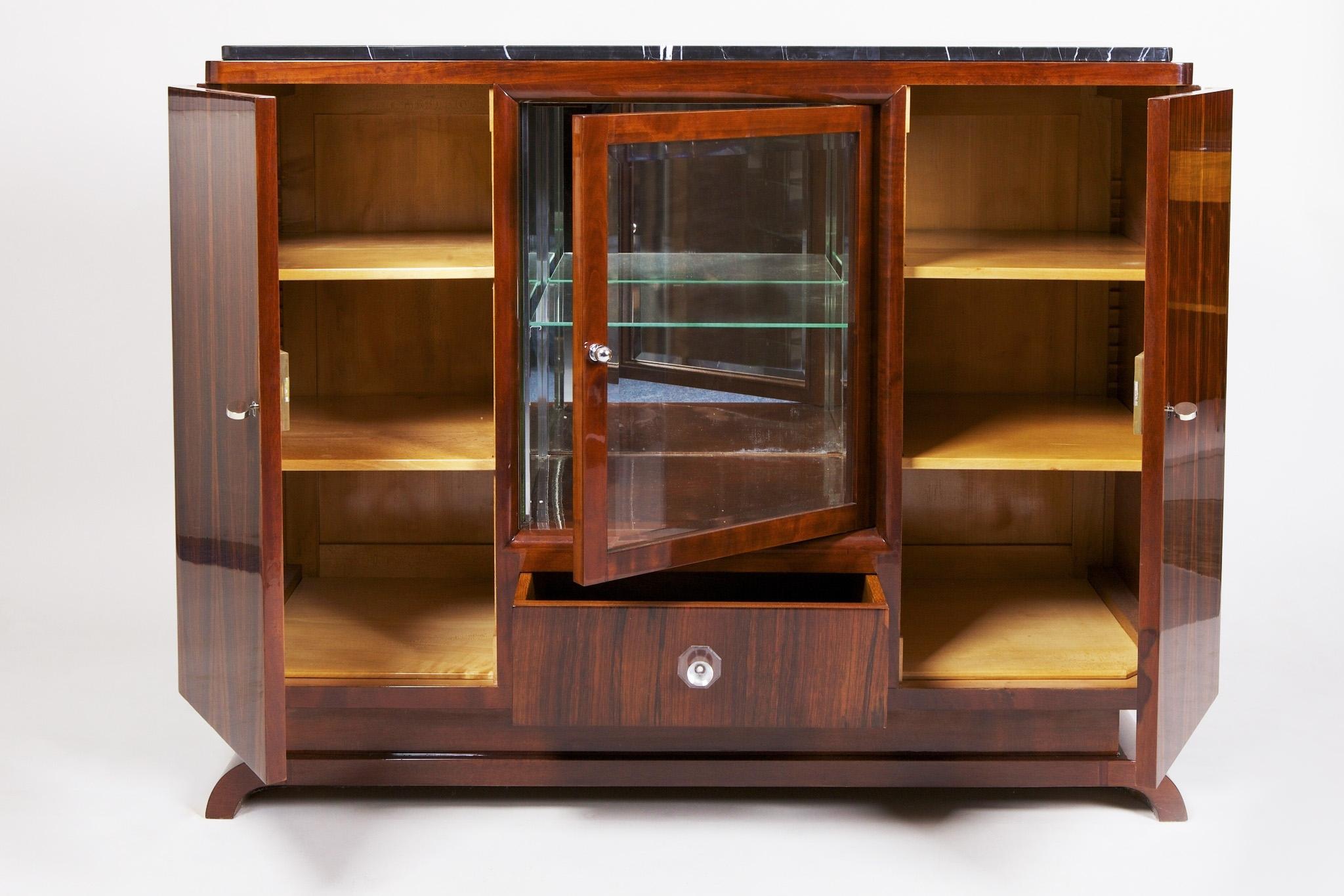 French sideboard with marble desk.
Style: Art Deco.
Period: 1930-1939.
Material: Palisander.
Professionally restored and the surface was made by piano lacquers to the high gloss.