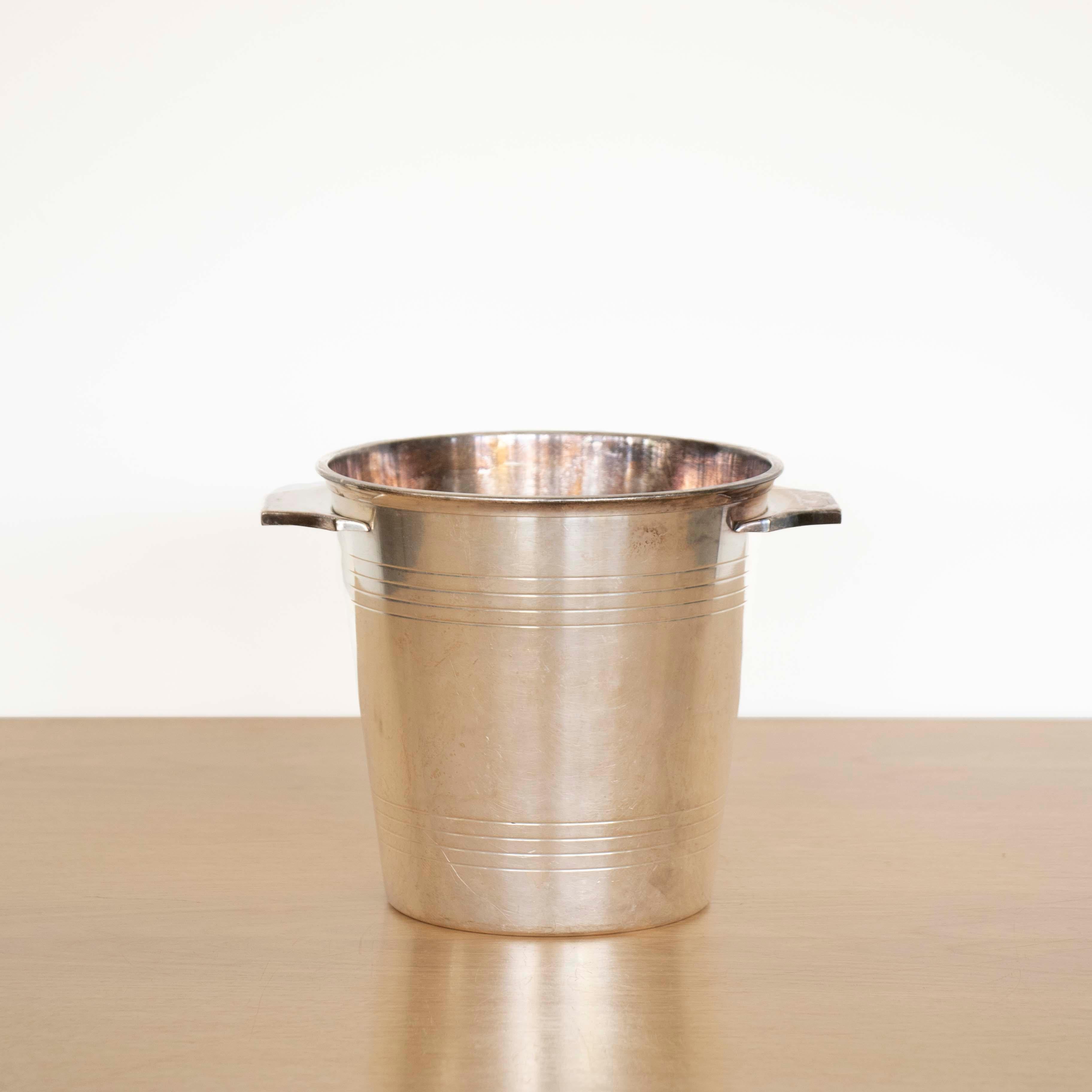 Beautiful Art Deco silver plate champagne bucket by St. Medard from France, 1930's. Tapered bucket with grooved rings around edge and two winged handles. Great age and patina. Stamped on underside. 