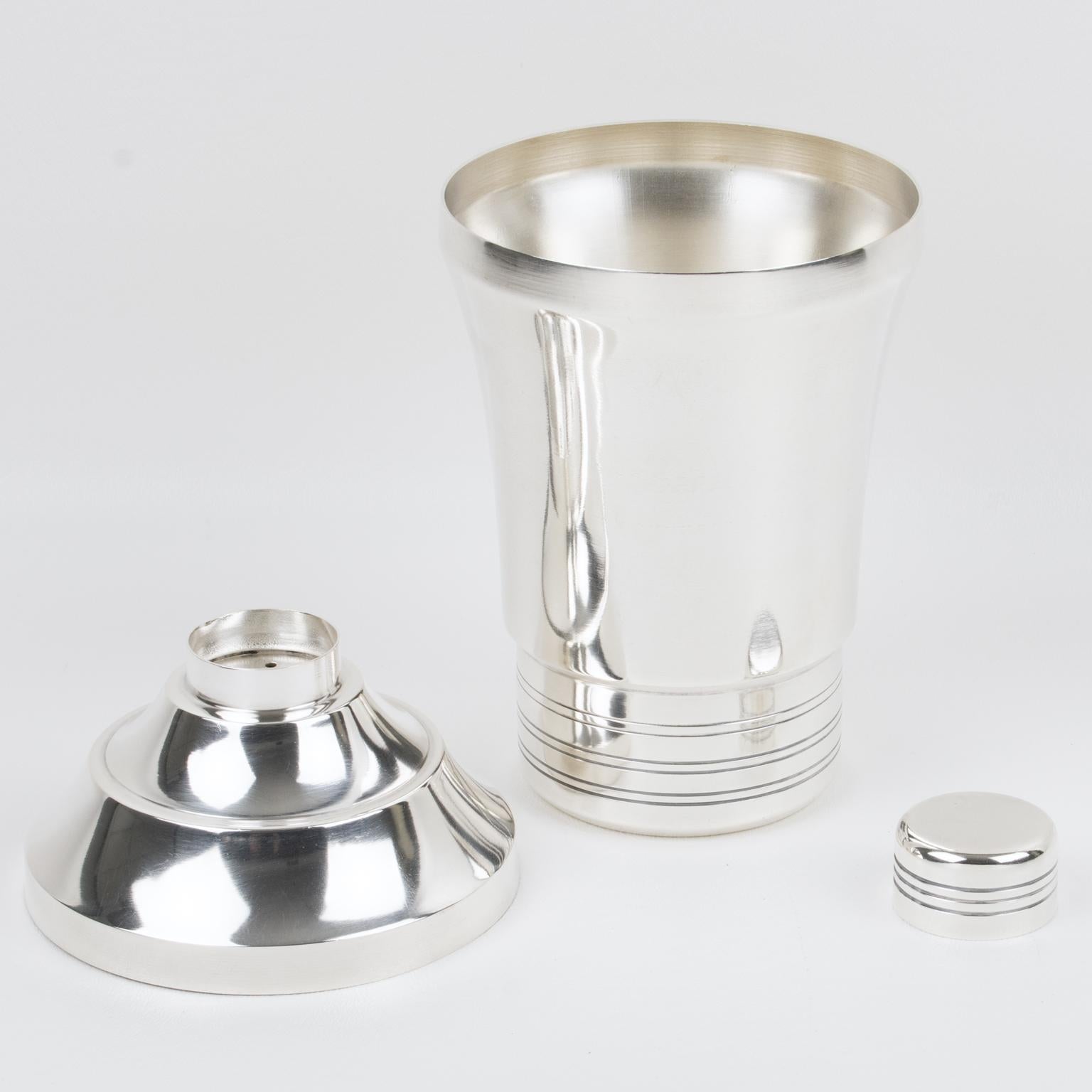 Elegant French Art Deco silver plate cylindrical cocktail or Martini shaker by silversmith G. Renard, Paris. Three-sectioned designed cocktail shaker with removable cap and strainer. Lovely geometric shape with typical Deco design. Marked underside