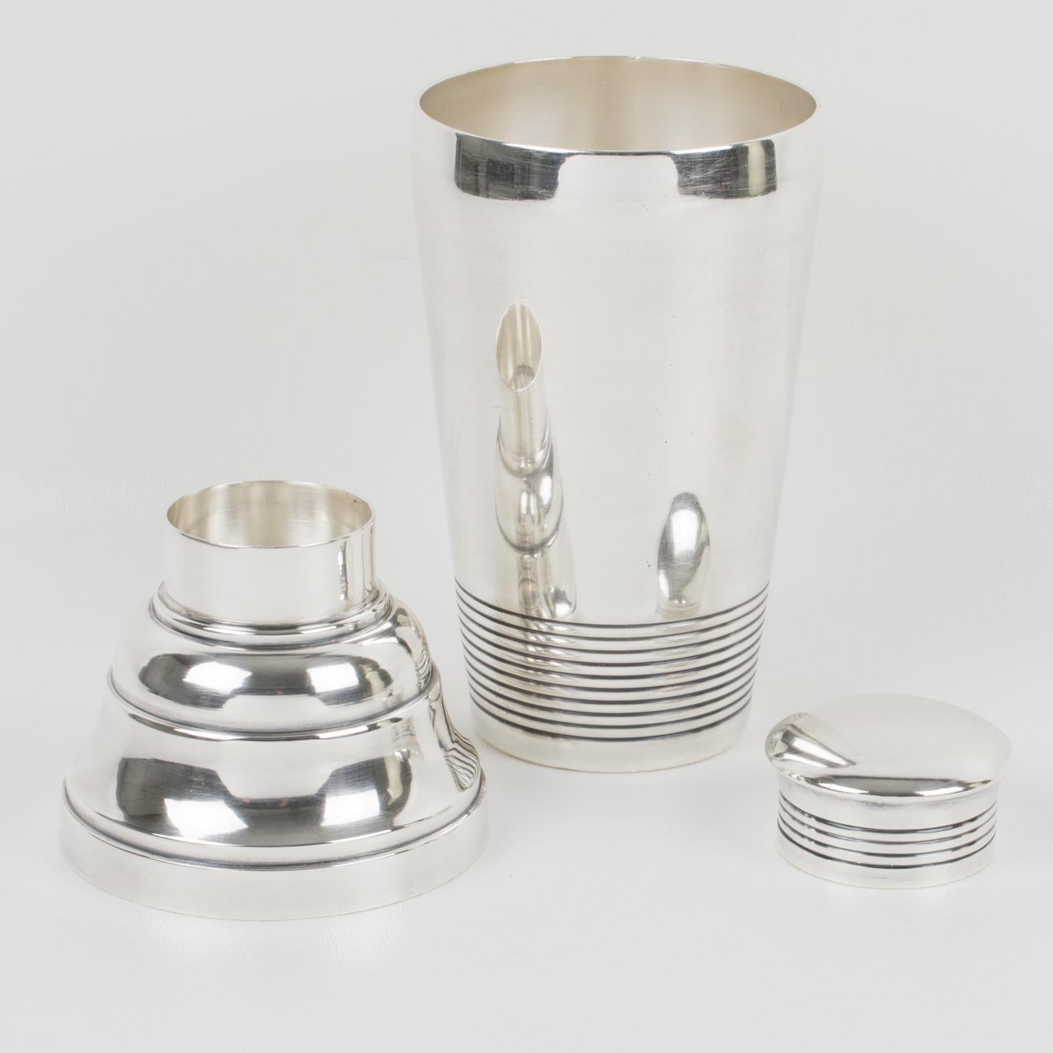 Elegant French Art Deco silver plate cylindrical cocktail or Martini Shaker by silversmith Ets Boyer et Fils, Paris. Three sectioned designed cocktail Shaker with removable CAP and strainer. Lovely Art Deco flair with geometric design. Marked