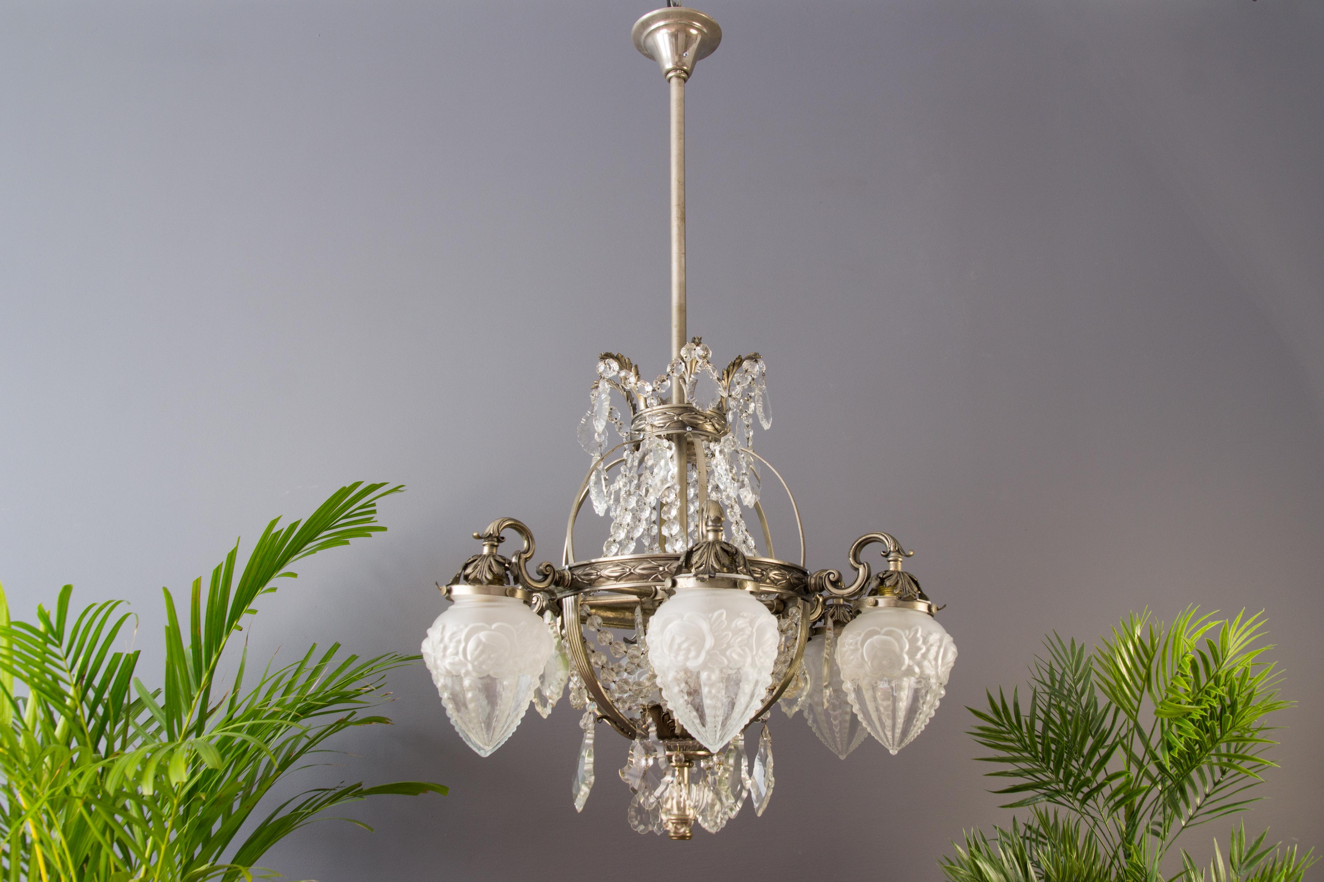 French Art Deco six-light bronze and crystal chandelier
Impressive French Art Deco silver color bronze chandelier with beautiful foliate details, decorated with crystal beaded chains and multifaceted and shaped crystal drops / prisms.
Six bronze