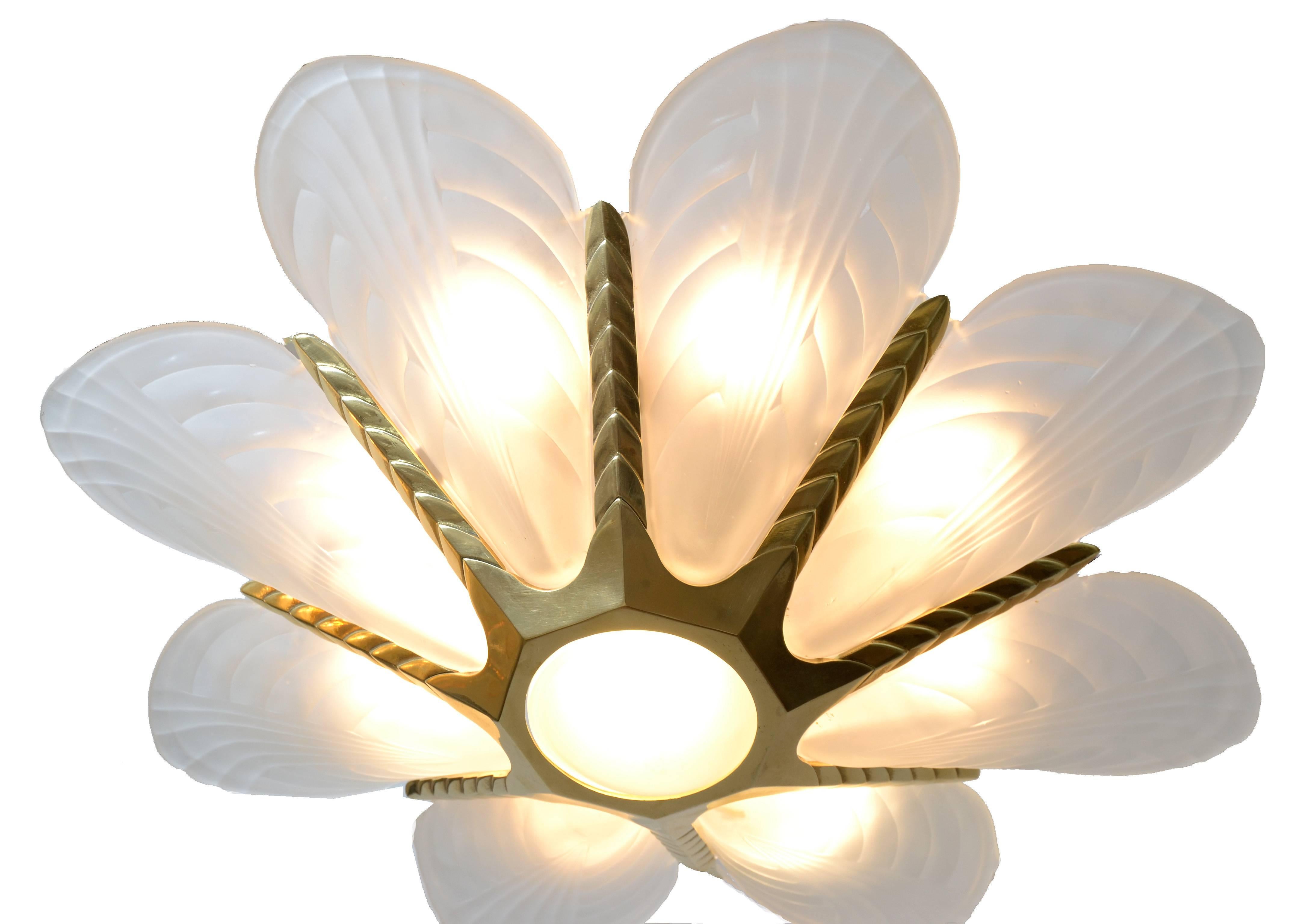 French brass Art Deco glass slip shade chandelier.
The brass core has wheat sheaf motif.
The chandelier is in perfect working condition and uses eight-light bulbs with max. 40 watts.
Canopy included and the length of the chain is 22.5 inches,