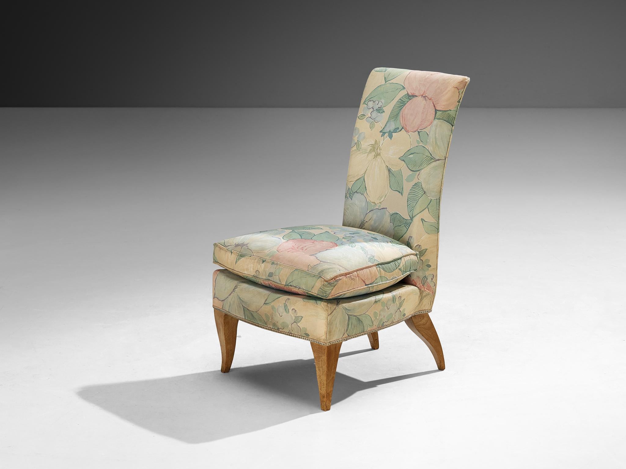 Lounge chair, beech, fabric, France, 1940s

This charming slipper chair, crafted in France during the 1940s, is a beautiful example of Art Deco elegance and craftsmanship. Upholstered in a soft, pastel floral fabric, it displays romantic nostalgia.