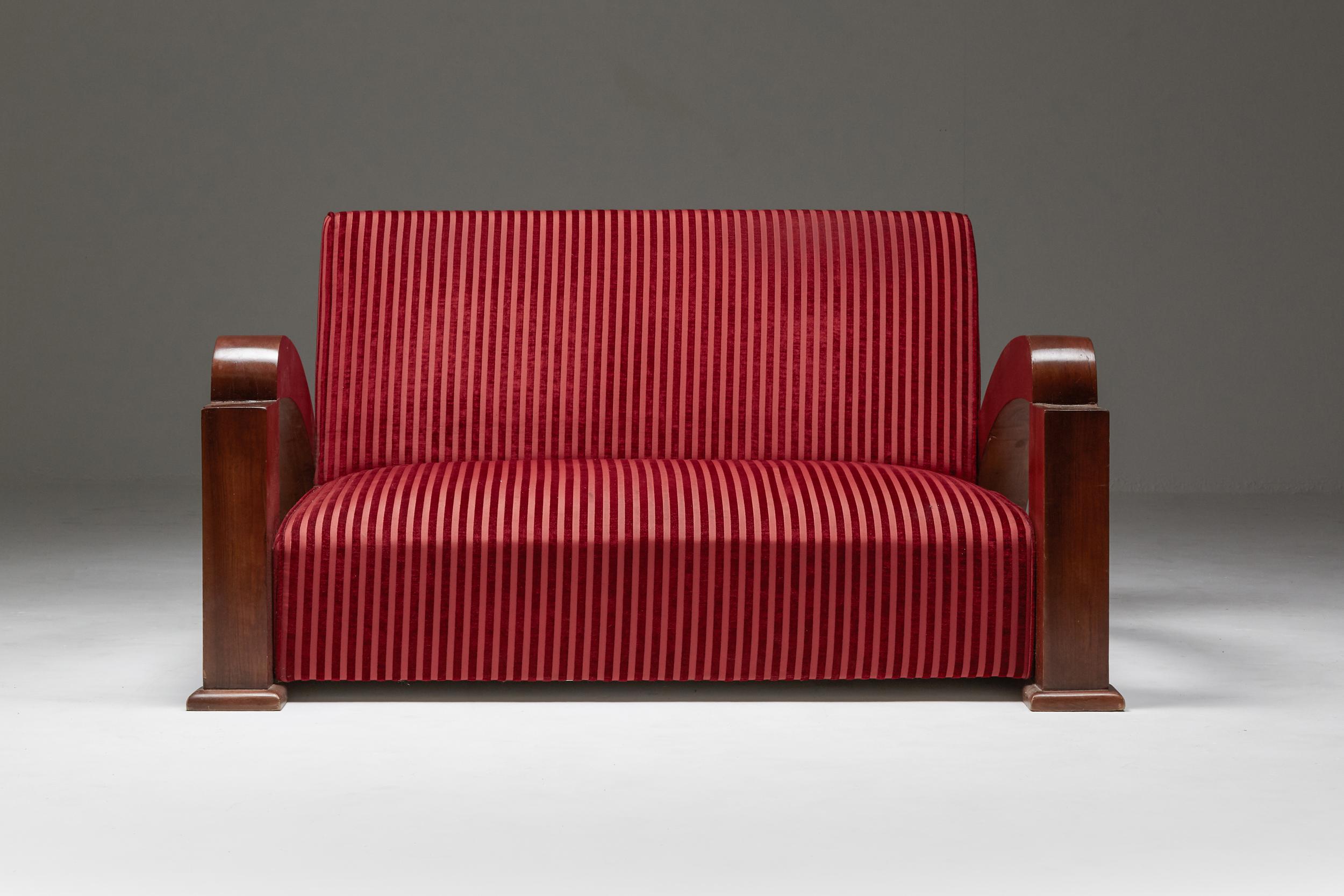 Art Deco, settee, red velvet, France, early to mid 20th century

Impressive settee
the swoosh like armrests give these bulky pieces an elegant and streamlined effect.
The fruitwood veneered frames are nicely contrasted by the red pin stripe