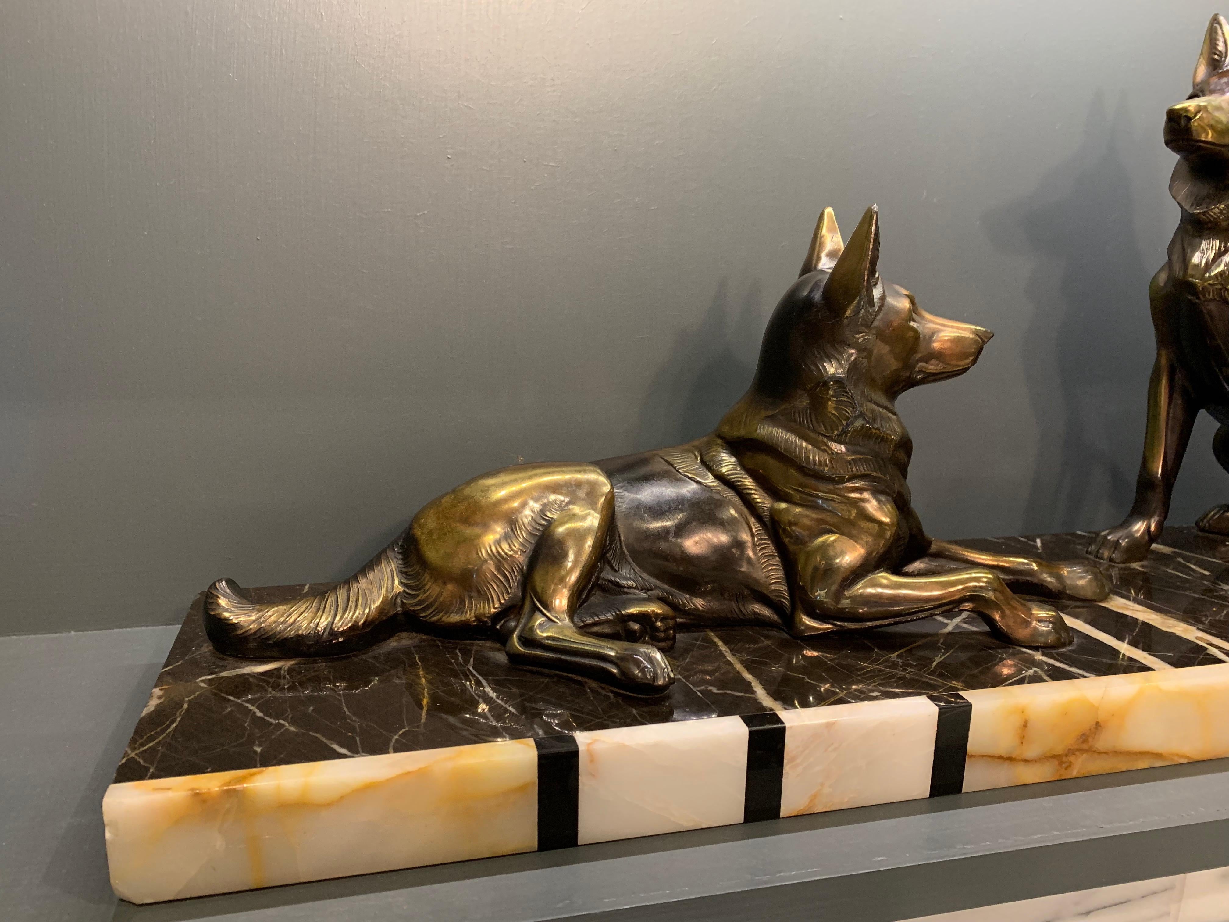 A substantial, very well cast pair of coloured, Spelter Alsatian dogs, sat on a striking, marble base.
Made in France, circa 1930.
No damage to the dogs.
A nibble to the marble in the left bottom corner of the marble base, as you look at it from