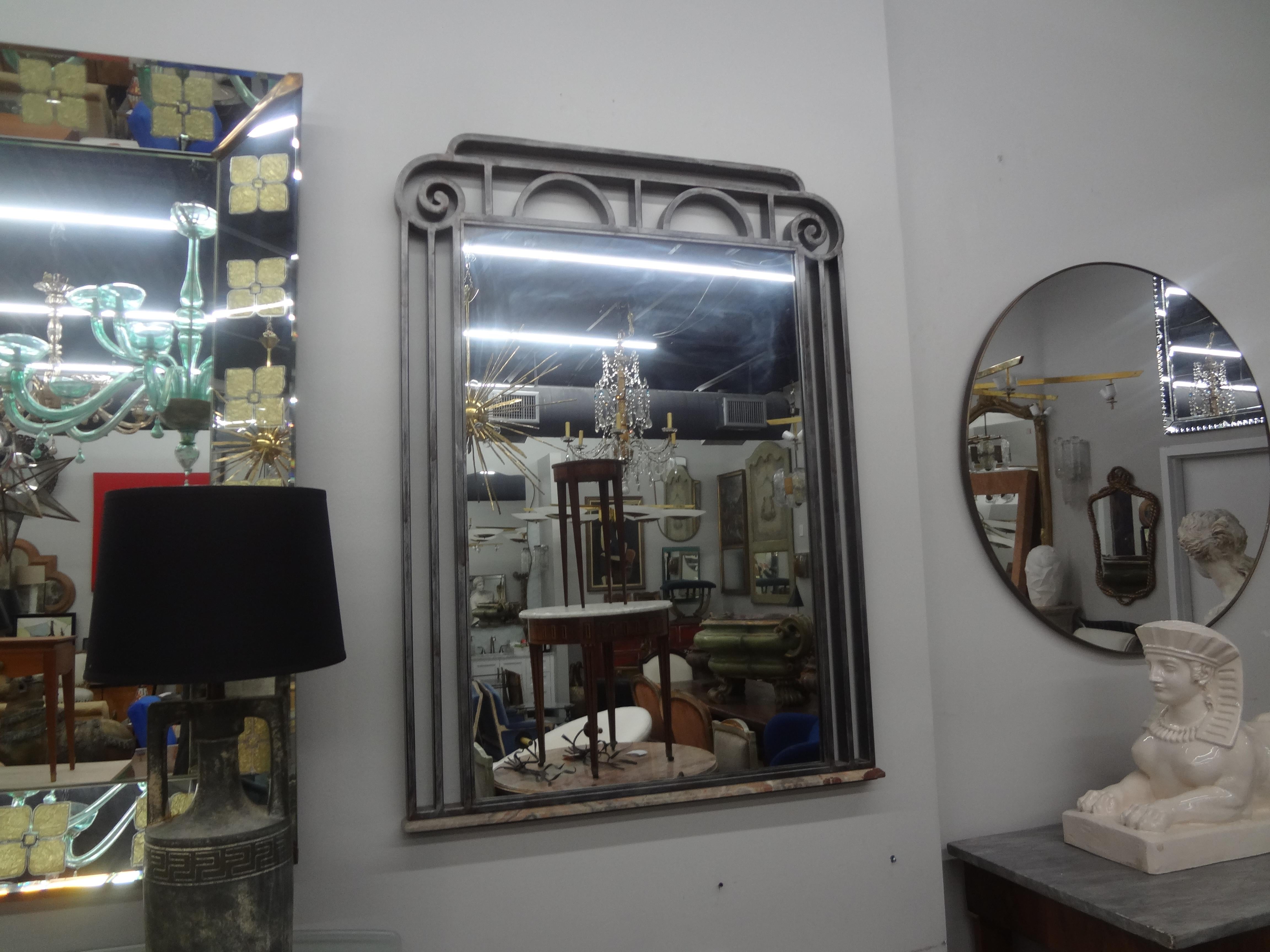 French Art Deco Steel Mirror With Marble Base.
This handsome late Art Deco French steel mirror with a strong geometric design has an unusual marble base and is well made.
Our versatile French mirror would work in a variety of interiors and locations.
