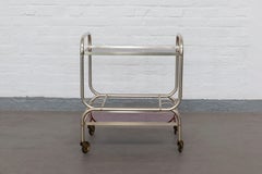 Carrello da bar francese Art Deco Streamline, alluminio placcato ottone e vetro color sangue di bue, 1935