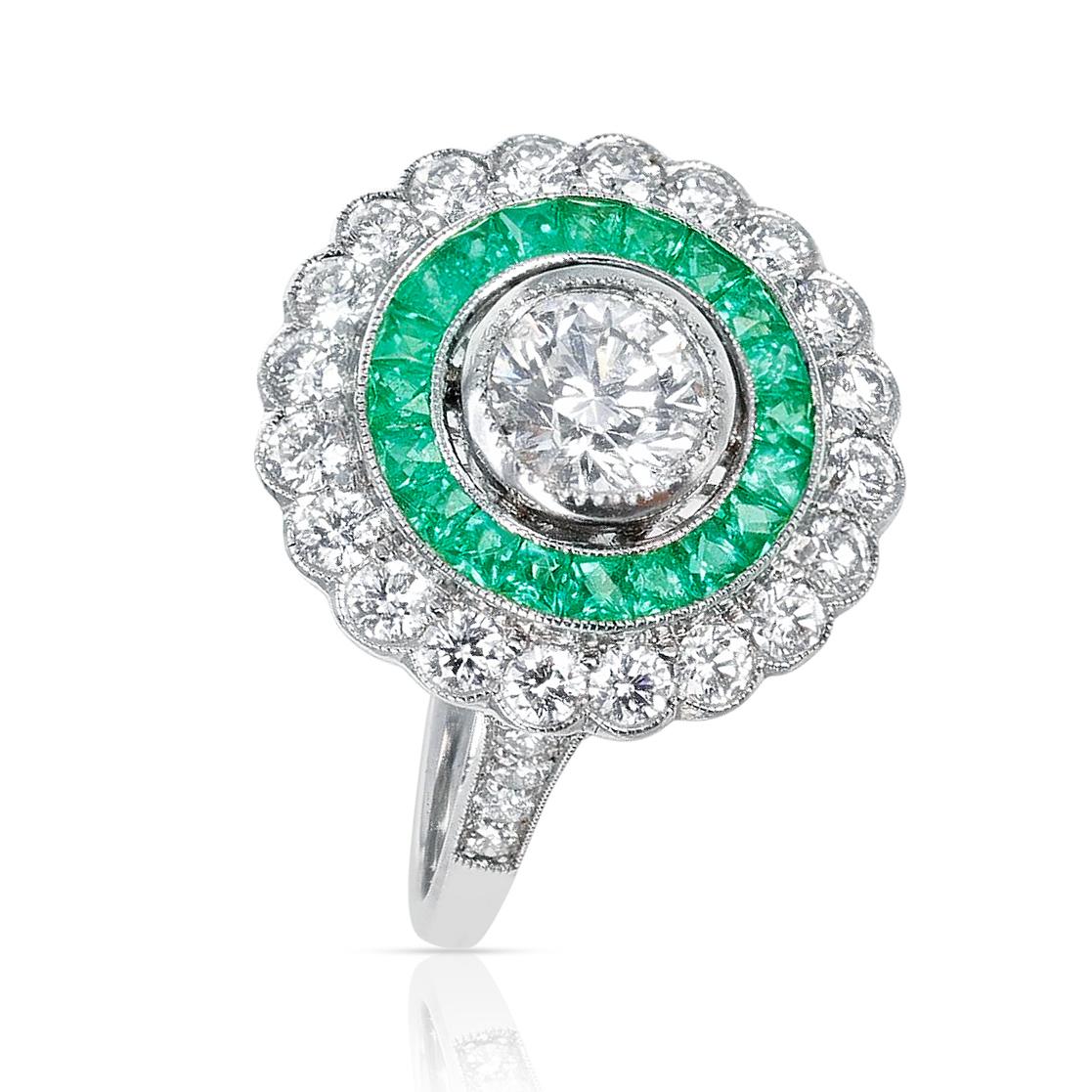 A beautiful French Art Deco Style Diamond and Emerald Ring made Platinum. The Center Diamond weighs 0.80 cts. and the other diamonds weigh 1.50 carats. Ring Size US 6.50.