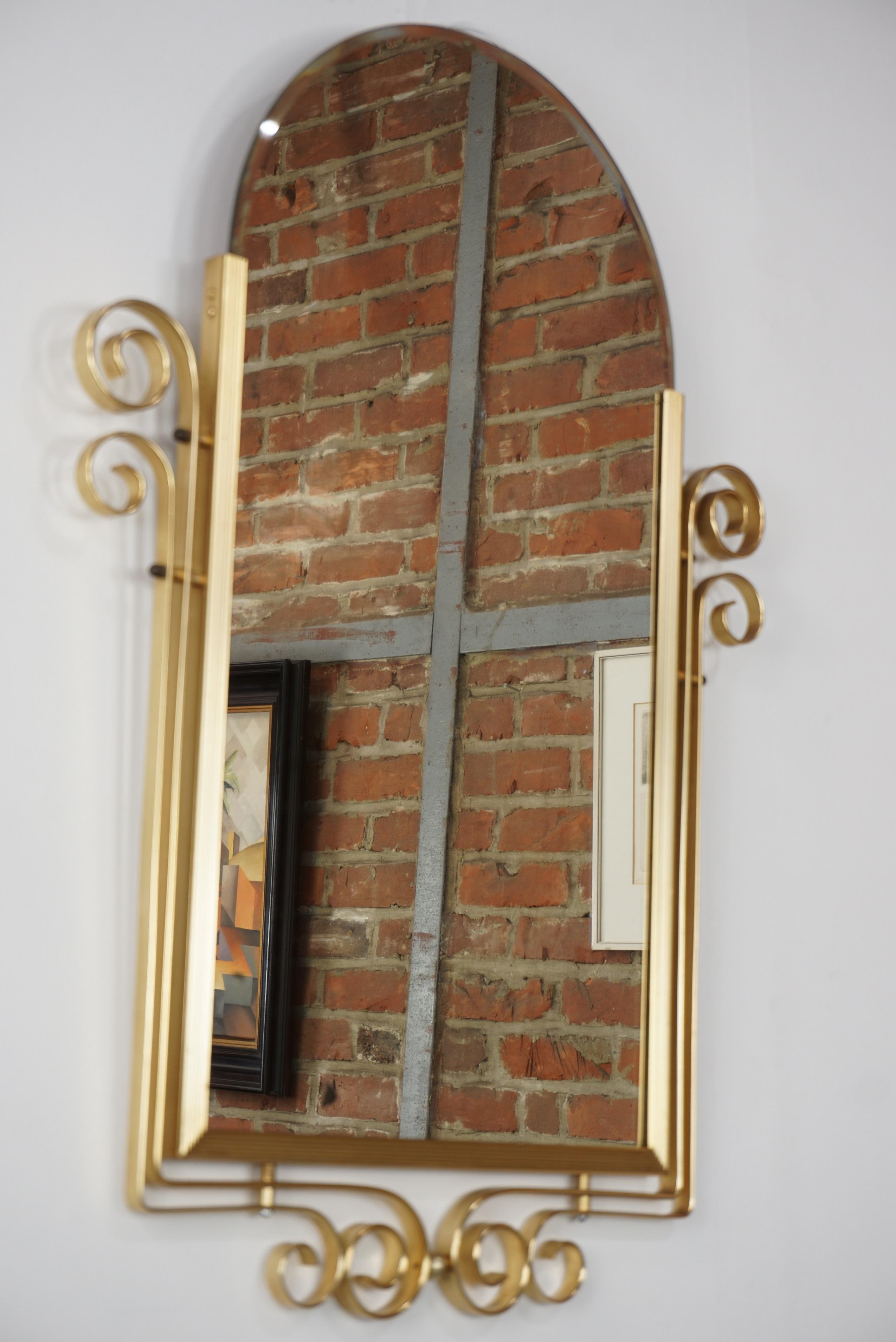 French Art Deco style beveled mirror with brass structure, beautiful patina of the mirror.