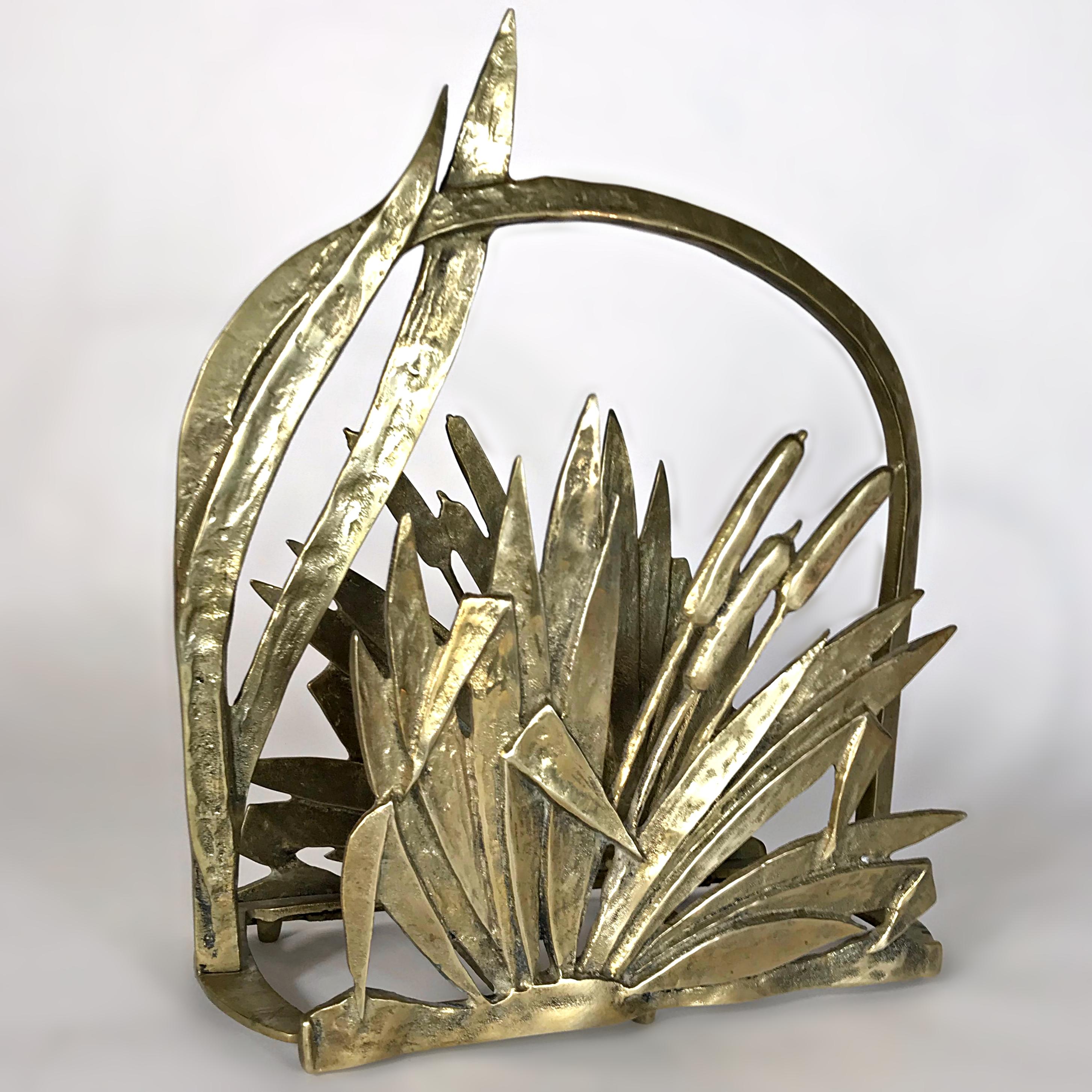 Beautiful faux bamboo plants magazine rack in heavy polished and patinated brass. This magazine holder is hand made of solid brass with gorgeous patina. Both sides feature botanical depictions in the typical style of Art Deco. Gorgeous piece in
