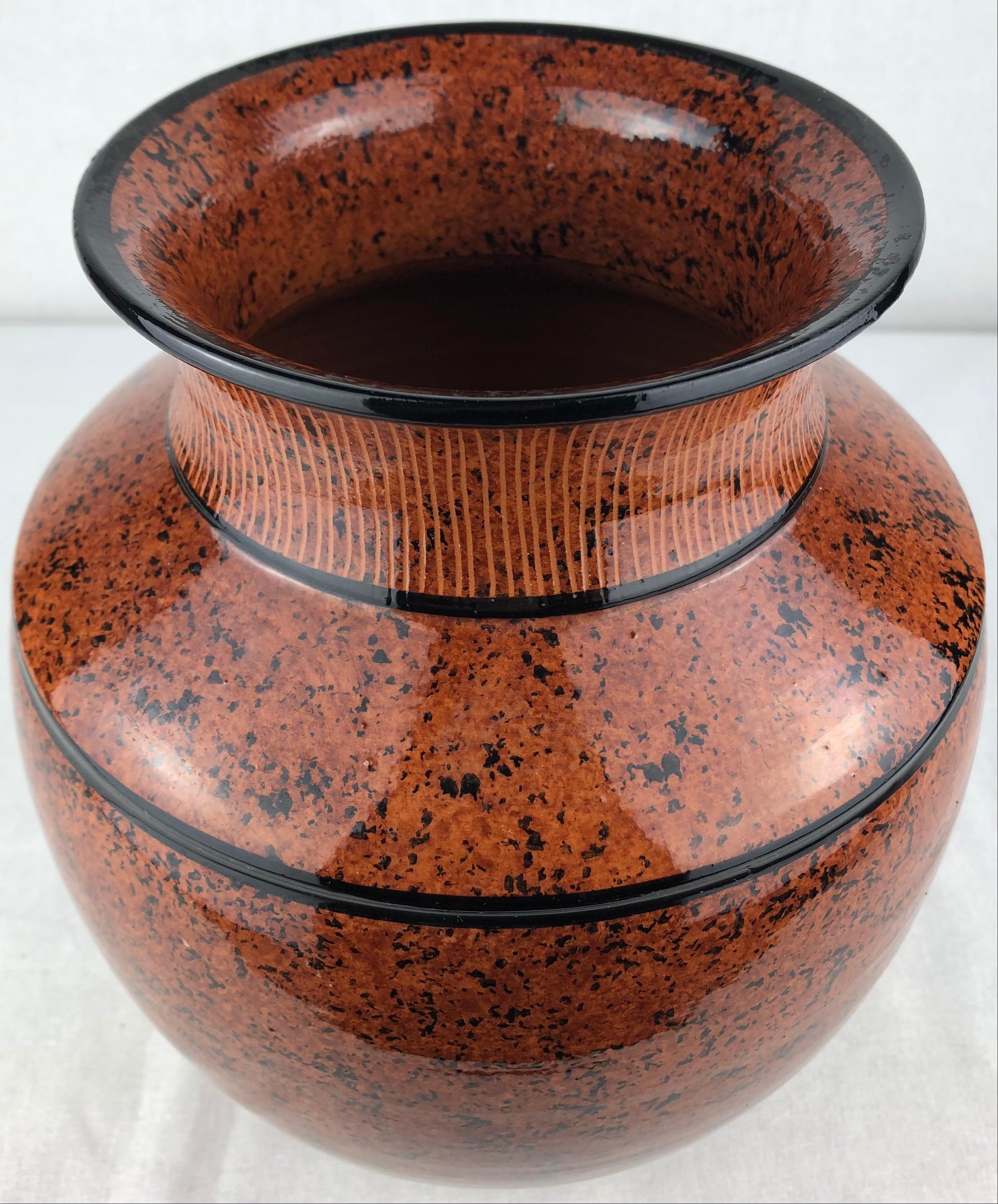 This dazzling glazed French Art Deco style ceramic vase or small planter was handcrafted. The mixture of colors are truly beautiful. Signed Picout.

It can enhance any shelf, table, credenza or countertop as it is truly an interesting decorative