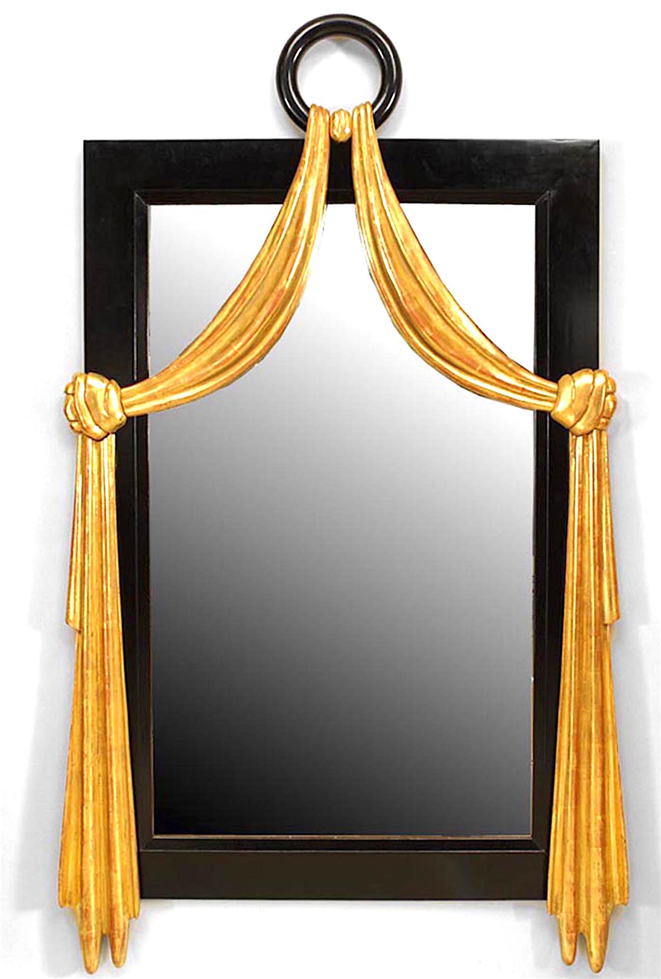 French Mid-Century (1940s) ebonized vertical wall mirror with gilt swag design and a ring pediment top.
