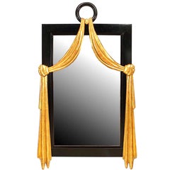 French Mid-Century Ebonized Wood and Gilt Swag Wall Mirror