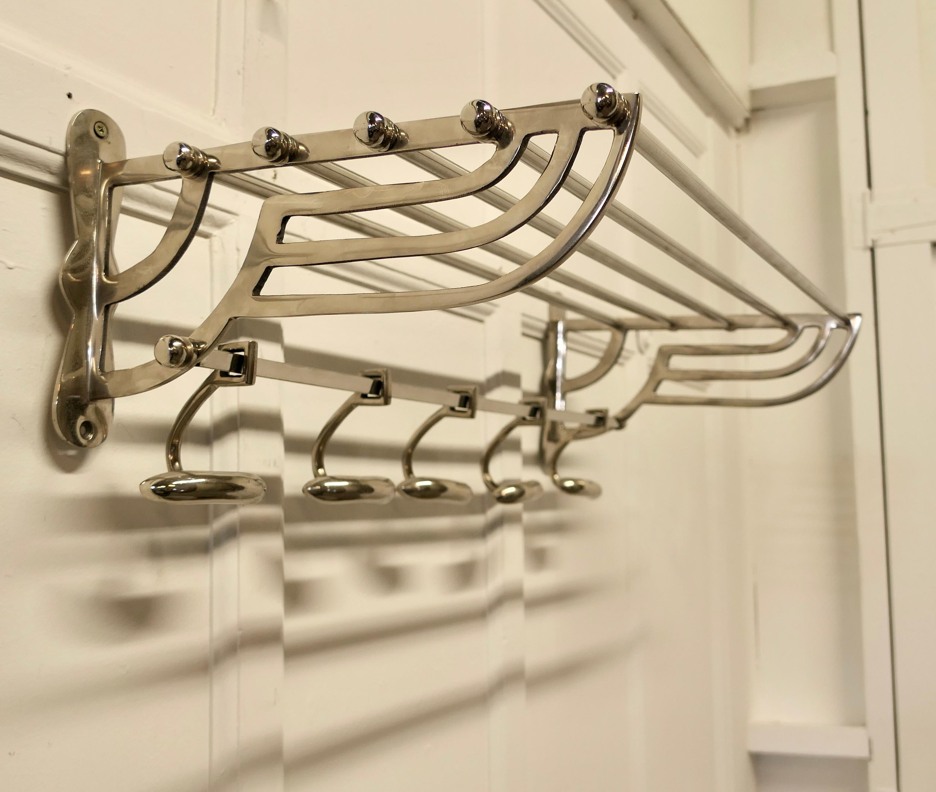 French Art Deco Style Hat and Coat Rack, Pullman Railway Train Style

 This Very Stylish Art Deco style hat and coat rack has five sliding hooks and an upper railed shelf 
Racks just like these were used on French railway trains just like the