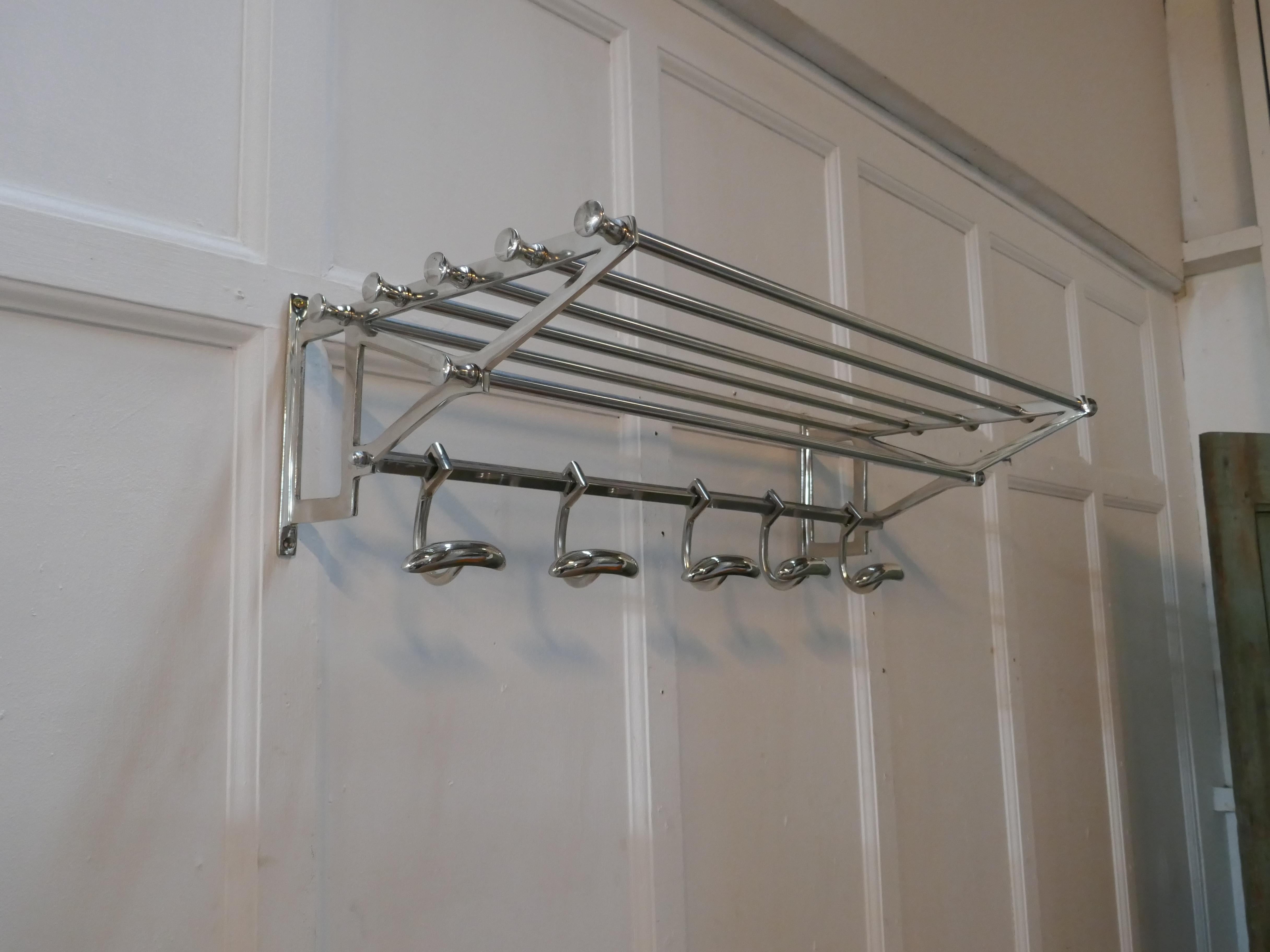 French Art Deco style hat and coat rack, Pullman railway train style

 This Art Deco style hat and coat rack has five sliding hooks and an upper railed shelf 
Racks just like these were used on French railway trains just like the ones on “the