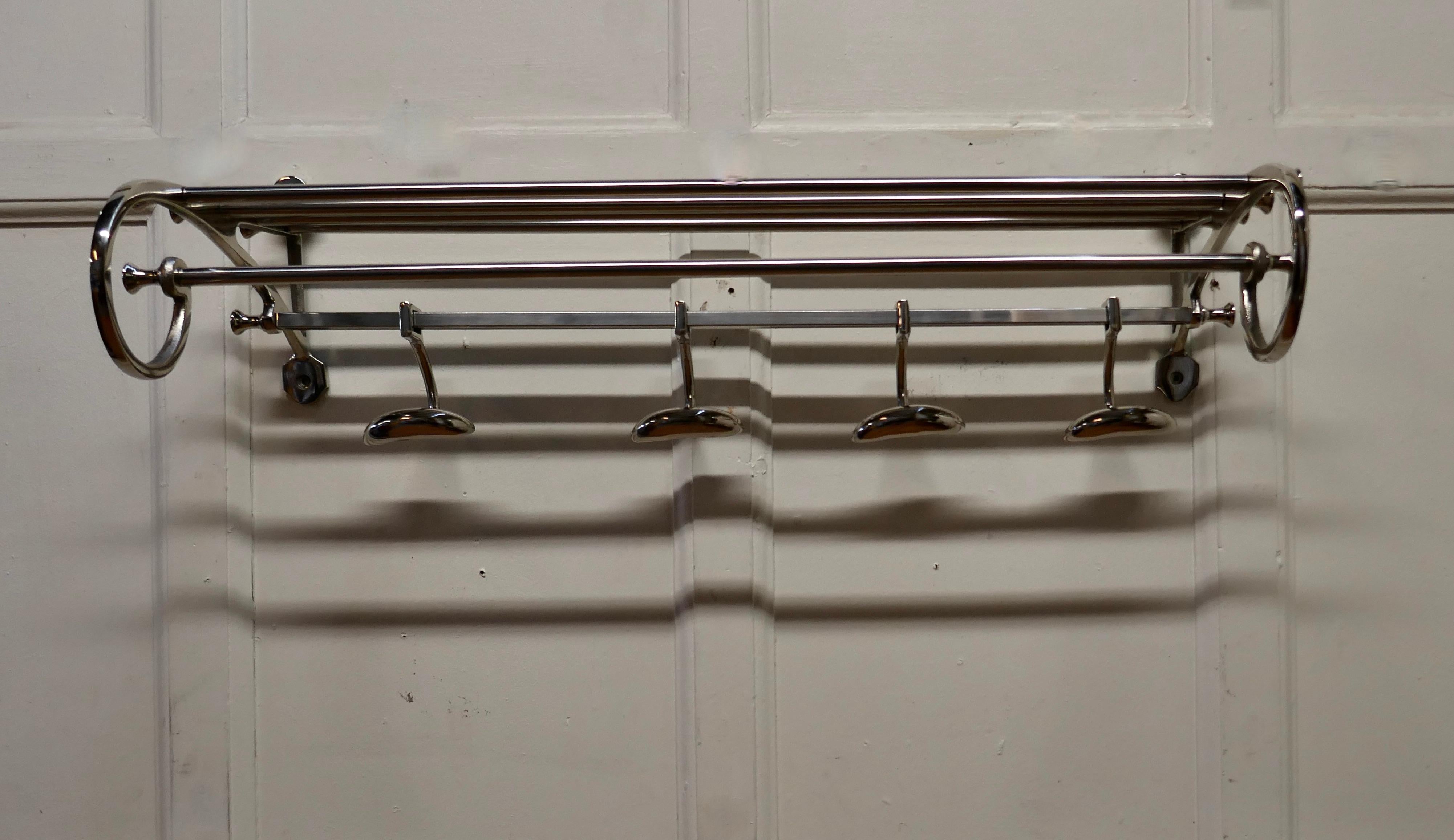 French Art Deco Style Hat and Coat Rack, Pullman Railway Train Style

 This Art Deco style hat and coat rack has four sliding hooks and an upper railed shelf 
Racks just like these were used on French railway trains just like the ones on “the