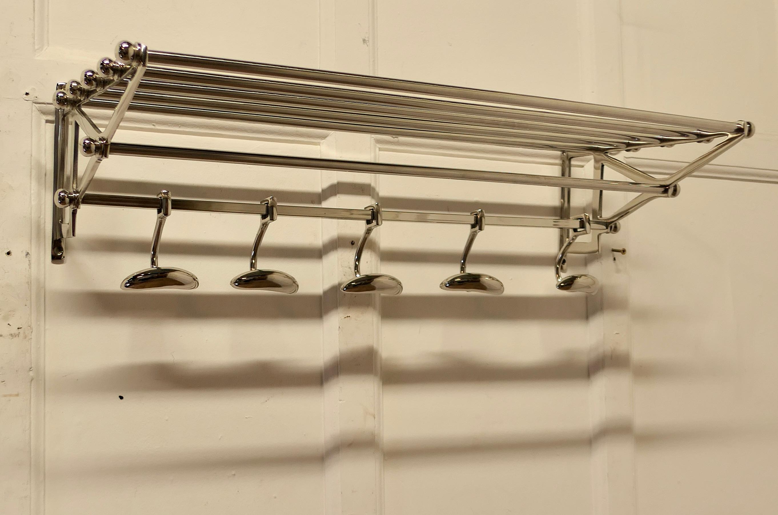 French Art Deco Style Hat and Coat Rack, Pullman Railway Train Style

 This Very Stylish Art Deco style hat and coat rack has five sliding hooks and an upper railed shelf 
Racks just like these were used on French railway trains just like the ones