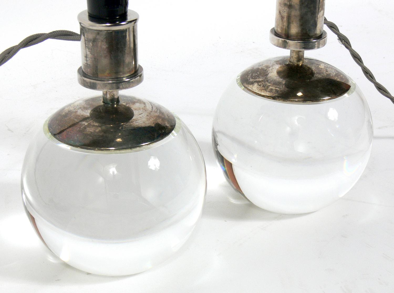 French Art Deco style Lamps, in the manner of Jacques Adnet. After an Adnet design of the 1930s, these examples are believed to be circa 1980s. They have been rewired and are ready to use. The price noted includes the shades.