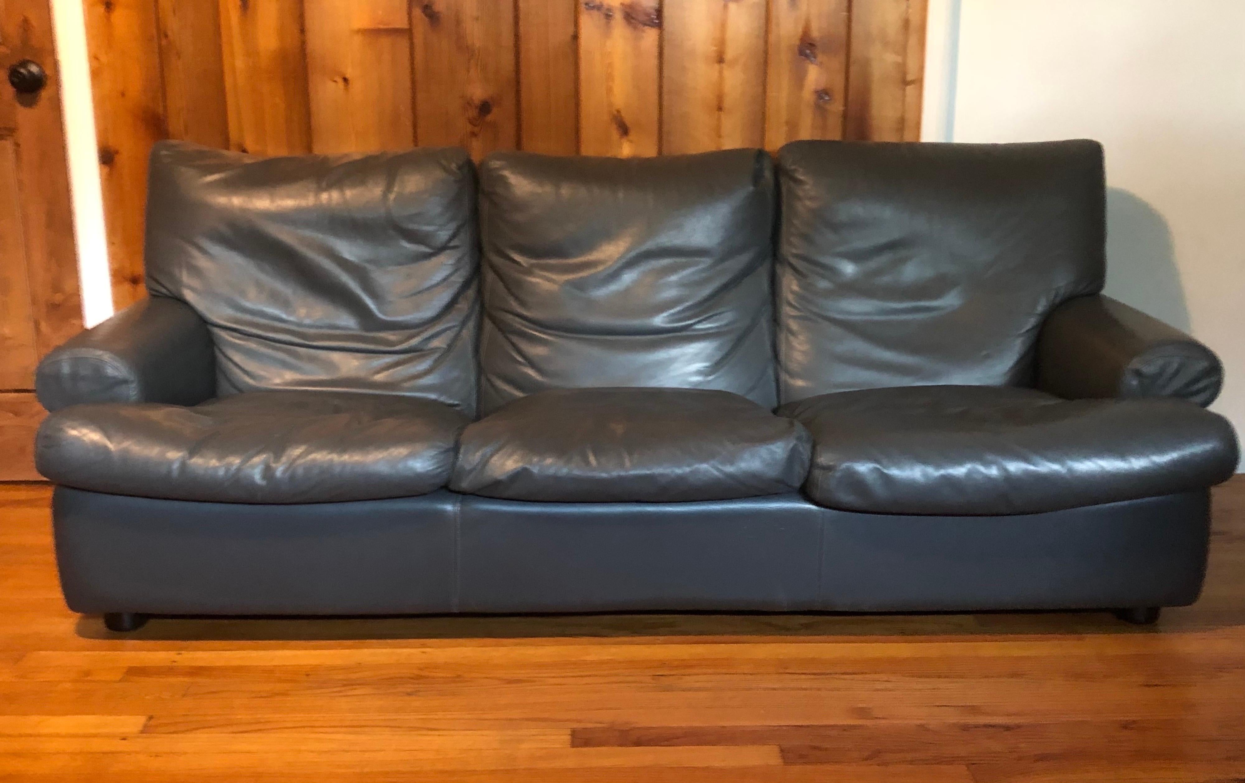 Classic French Art Deco 1930 style stitched, grey leather sofa circa 1970 with pure, clean lines and an elegant, relaxed form. The leather has been lightly used and is in good overall condition. The seat and back cushions are down filled. The sofa /
