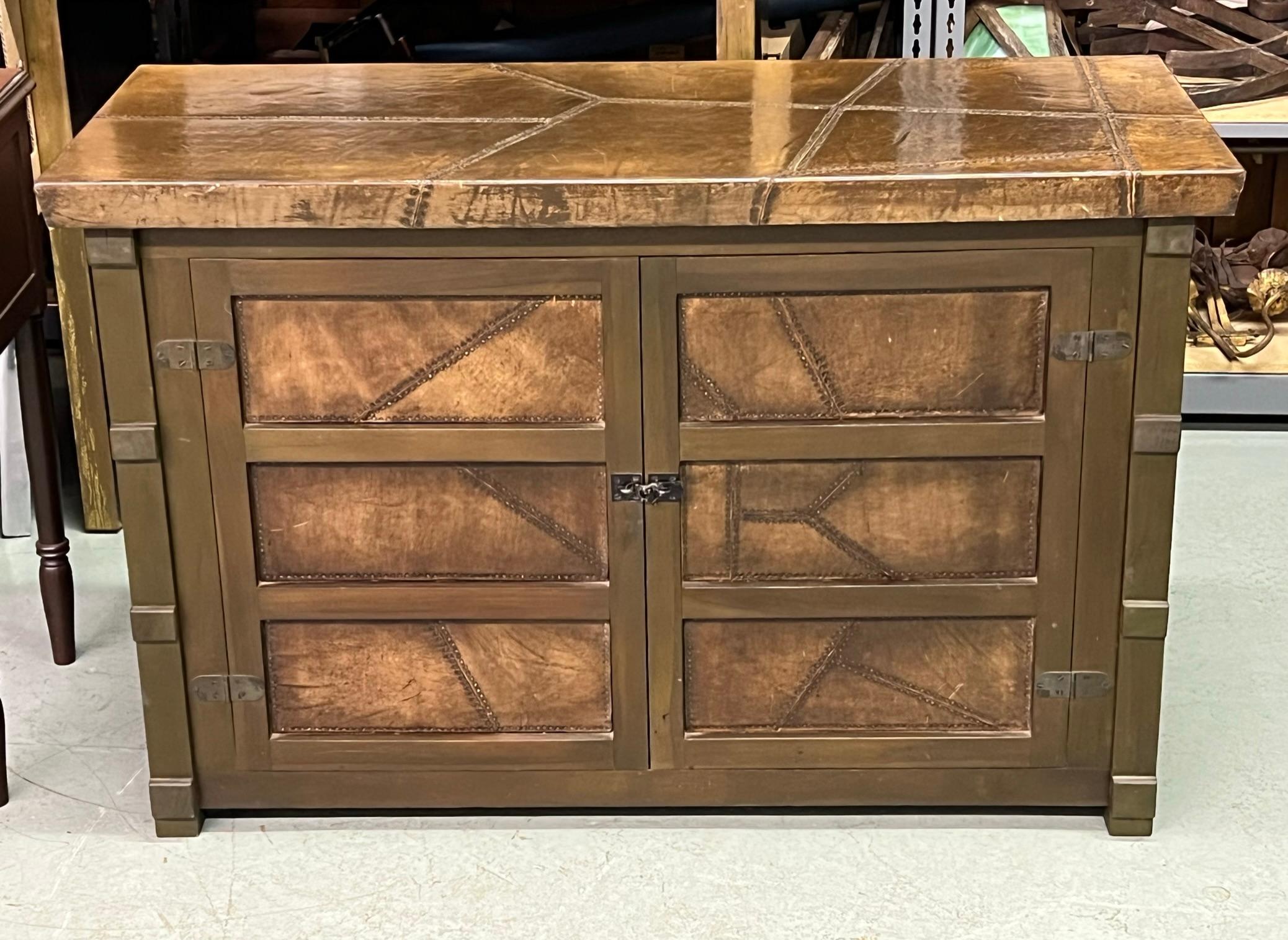 A Rare French Art Deco style cabinet / Buffet in the style of Jean-Michel Frank. The piece was likely made as a commission by a small workshop as it is a 1 of a kind piece. It is unique in that it combines modernism with a rustic sensibility. It