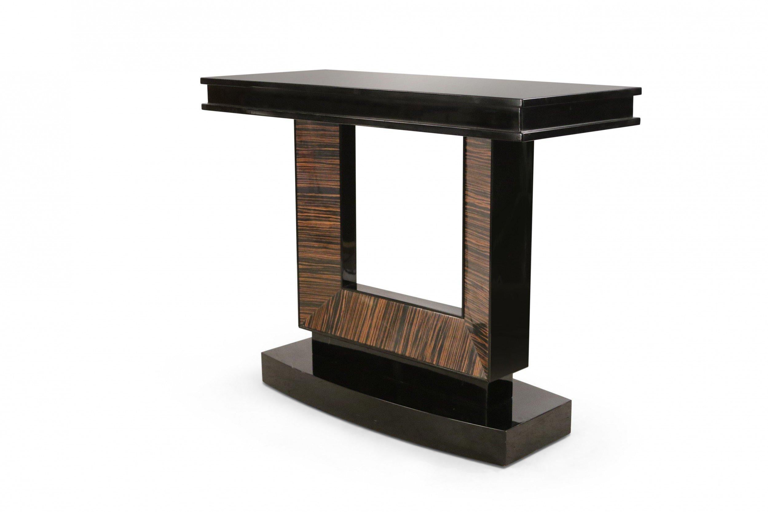 French Art Deco-style console table with a black lacquered rectangular base and top and a square cut-out support with palisander veneer.