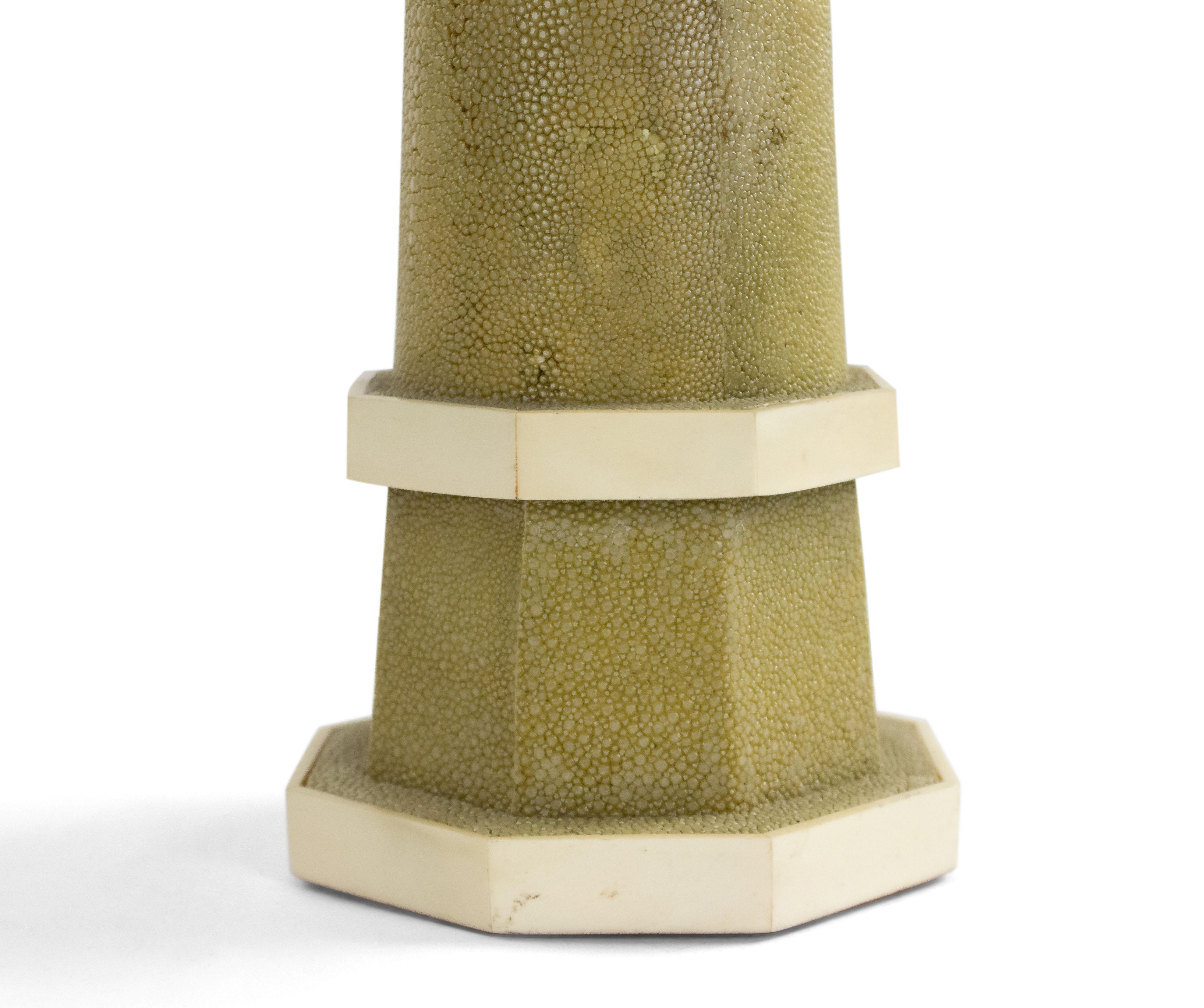 French Art Deco style sea green colored shagreen table lamp of spreading cylindrical form with bone molded edges.
