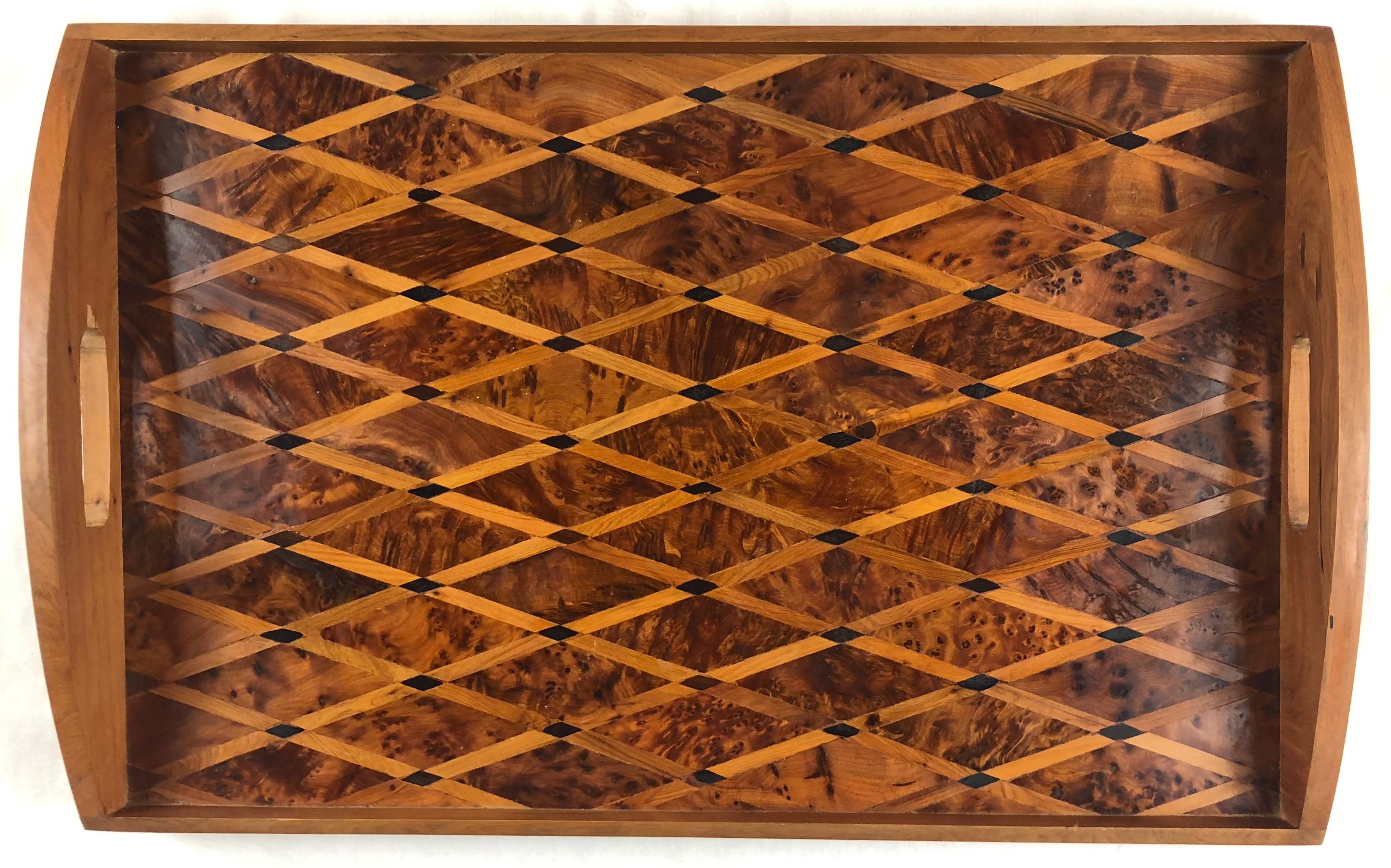 A lovely French art deco wood serving tray. 

This elegant tray features beautiful handles, is sturdy enough to use daily. This is a very good example of the period perfect style for collectors, or for someone simply looking for a tray to present