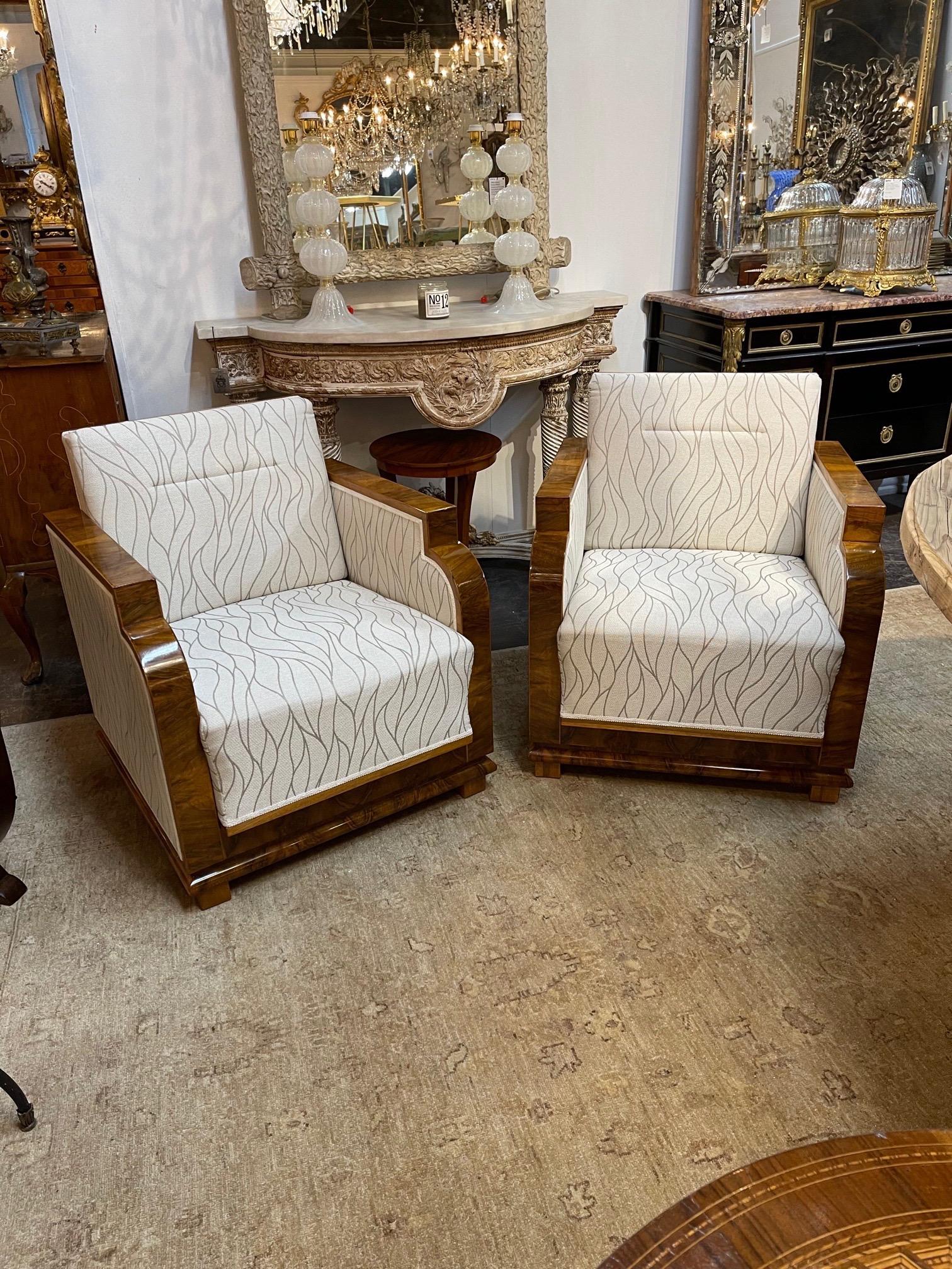 Beautiful French Art Deco style walnut armchairs. Upholstered in a pretty grey and white fabric and the finish on the wood is exceptional. Very nice! Note price listed is per item.