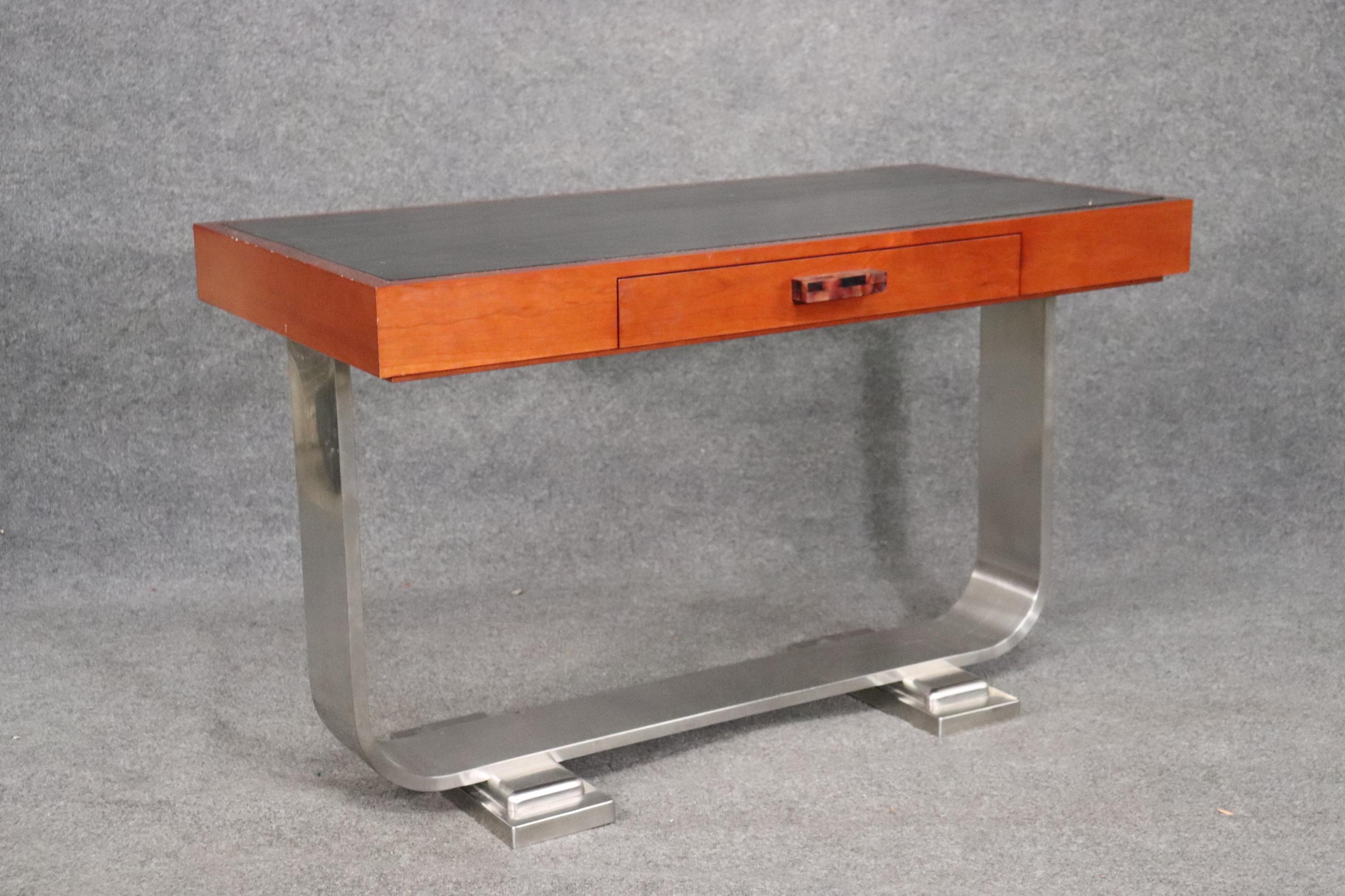 This is a beautiful Art Deco style custom-made writing table with a tasselated bone handle and birch. The base is solid stainless steel. The desk has metal runners on the drawer for smooth operation. The desk measures 48 wide x 24 deep x 30 tall.